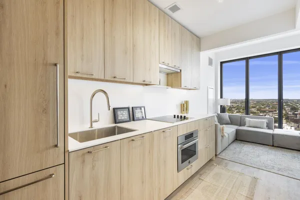 a kitchen with stainless steel appliances a white cabinets and a sink