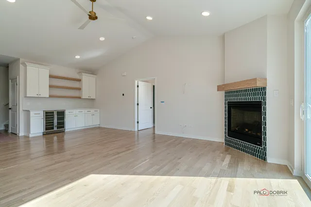 wooden floor in an empty room with a fireplace