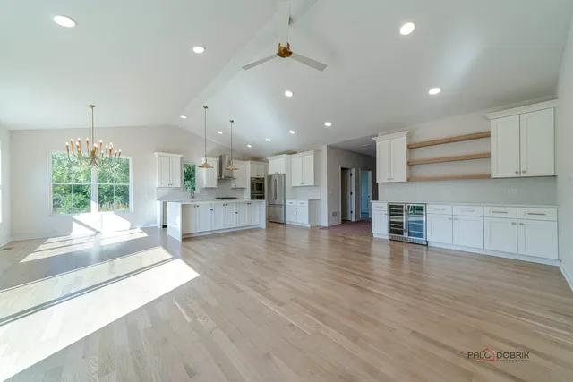 a view of kitchen with cabinets and wooden floor