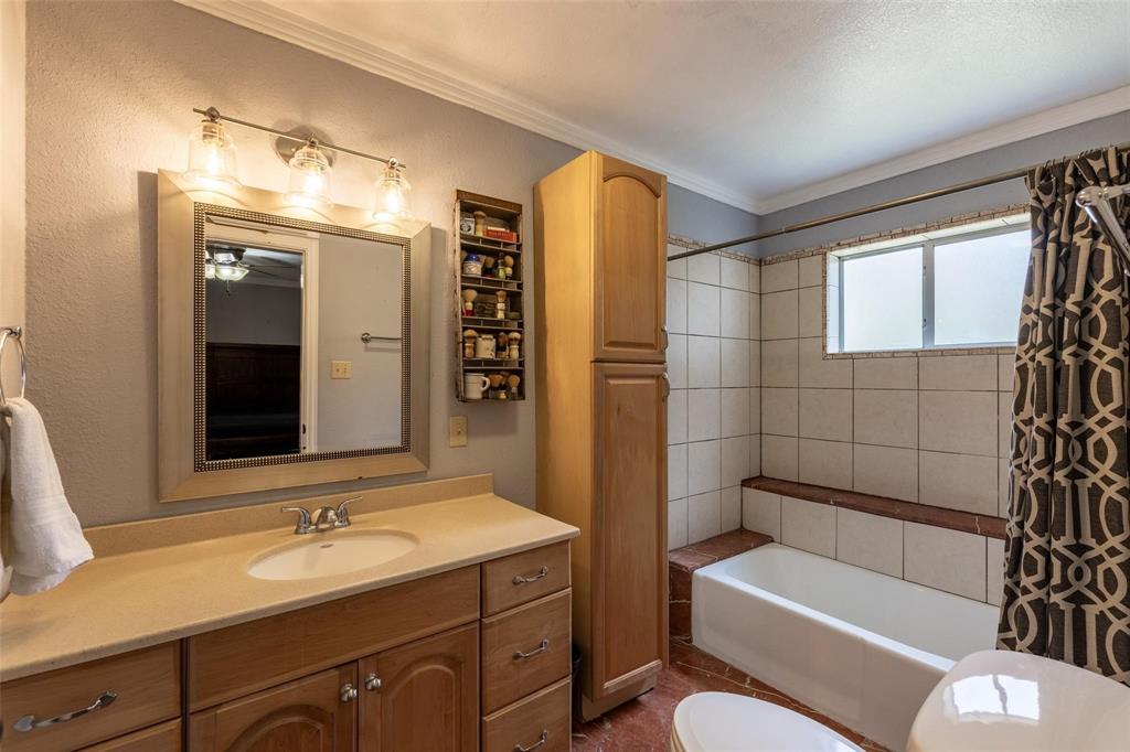 13360 Miller Road Azle, TX 76020 - Photo 16 of 23 a bathroom with a sink toilet and shower