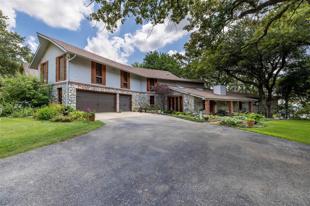 13360 Miller Road Azle, TX 76020 - Photo 2 of 23 a front view of house with yard and green space