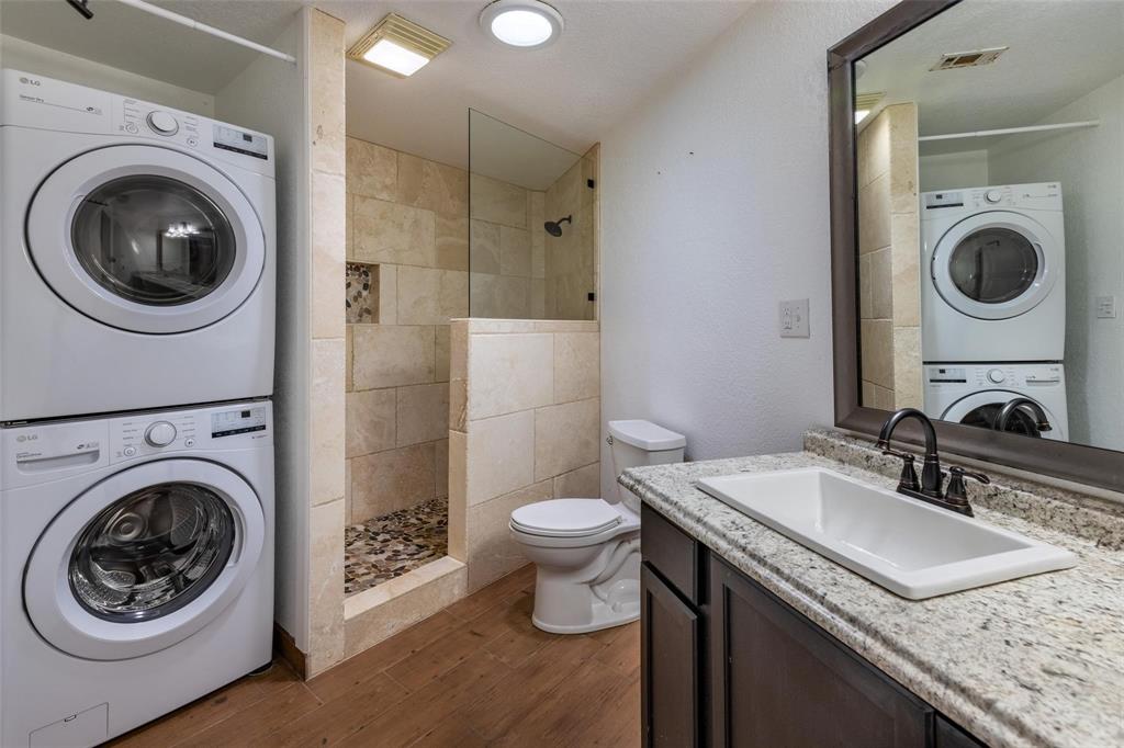13360 Miller Road Azle, TX 76020 - Photo 21 of 23 a bathroom with a sink a toilet and a mirror