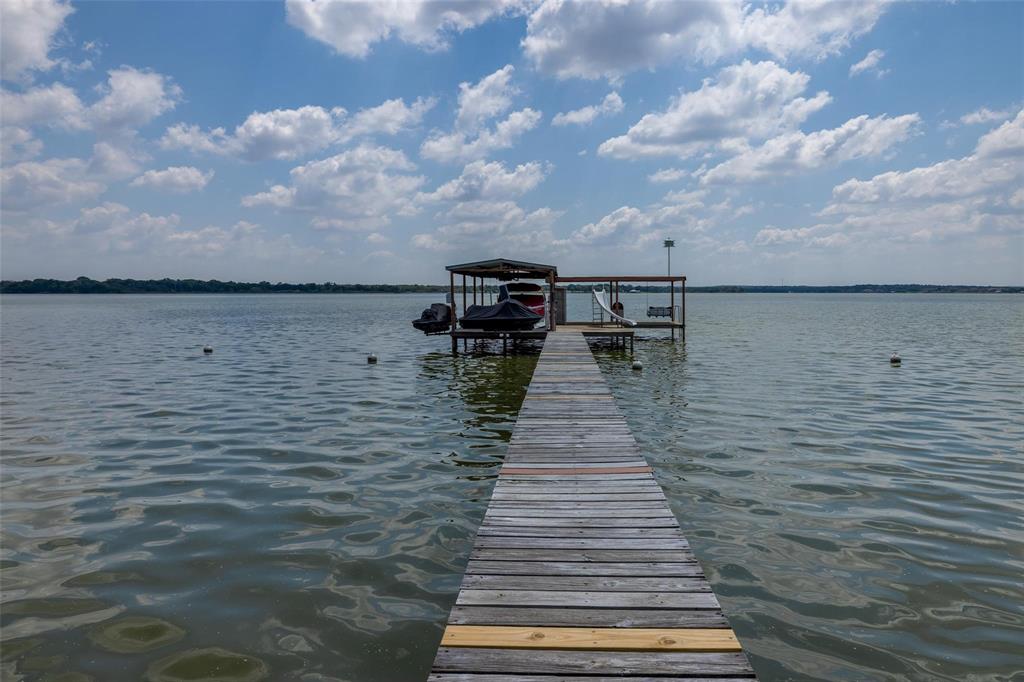 13360 Miller Road Azle, TX 76020 - Photo 23 of 23 a view of a lake with wooden stairs
