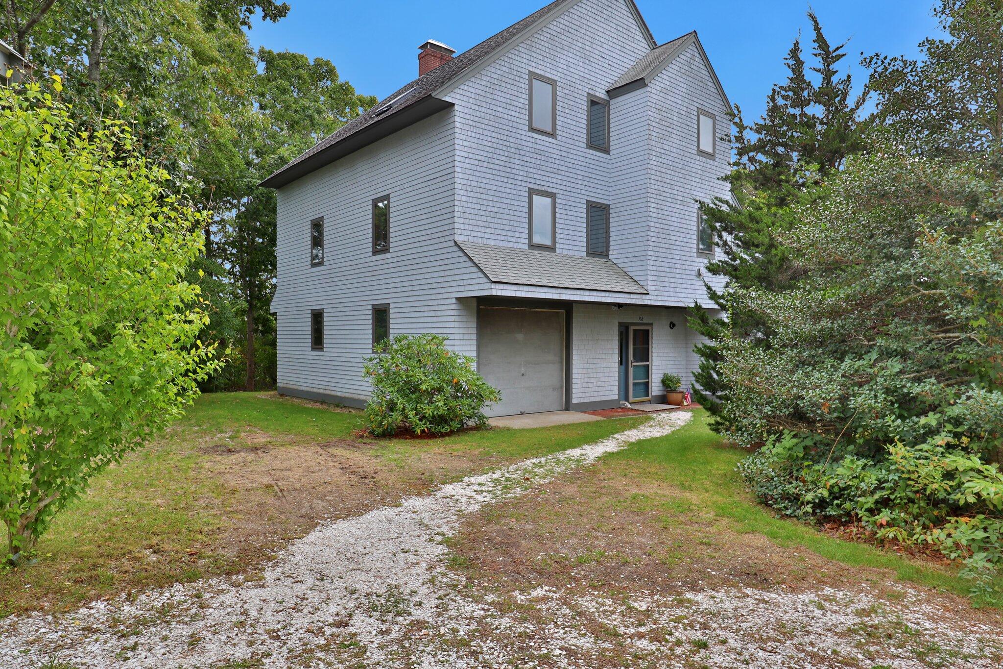 362 Monomoscoy Road Mashpee, MA 02649 - Photo 3 of 48 front view of a house with a yard