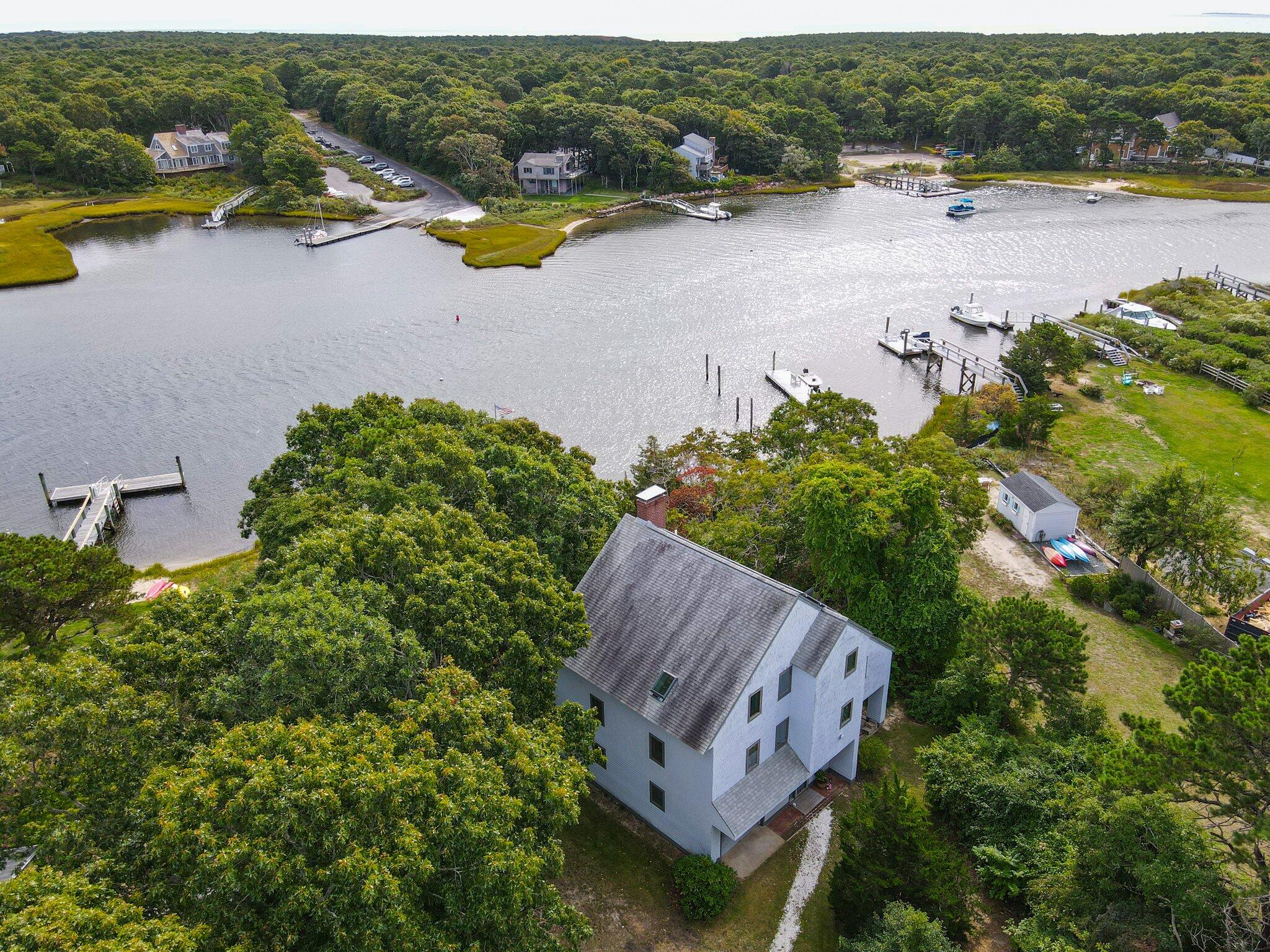 362 Monomoscoy Road Mashpee, MA 02649 - Photo 8 of 48 an aerial view of a house with garden space and lake view