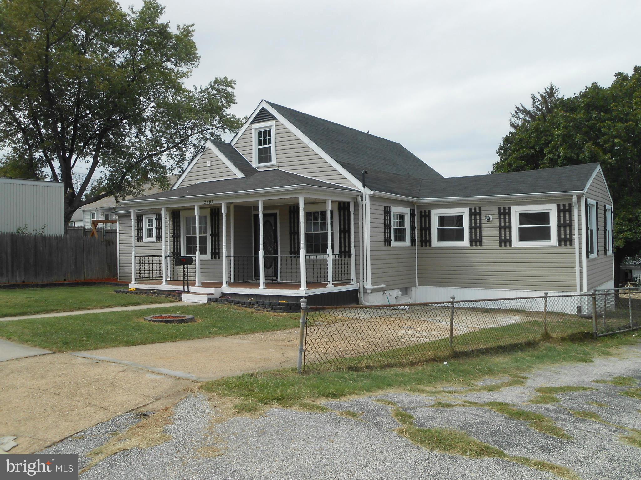 2405 Meadow Road Baltimore, MD 21222 - Photo 1 of 13 a front view of a house with a yard