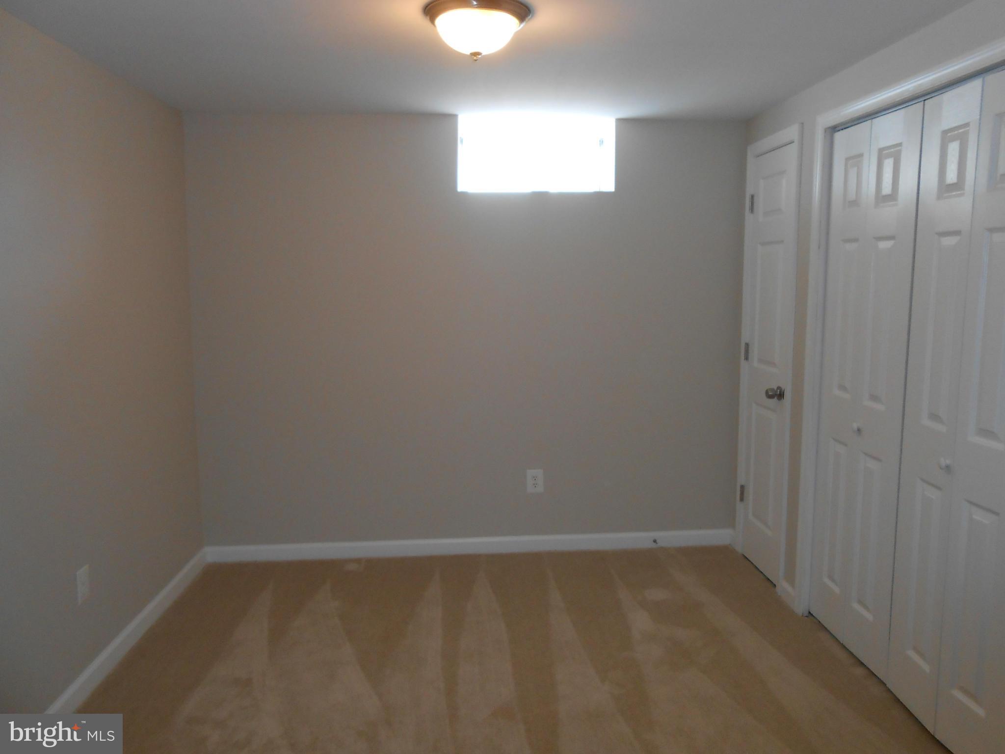 2405 Meadow Road Baltimore, MD 21222 - Photo 11 of 13 a view of an empty room and window