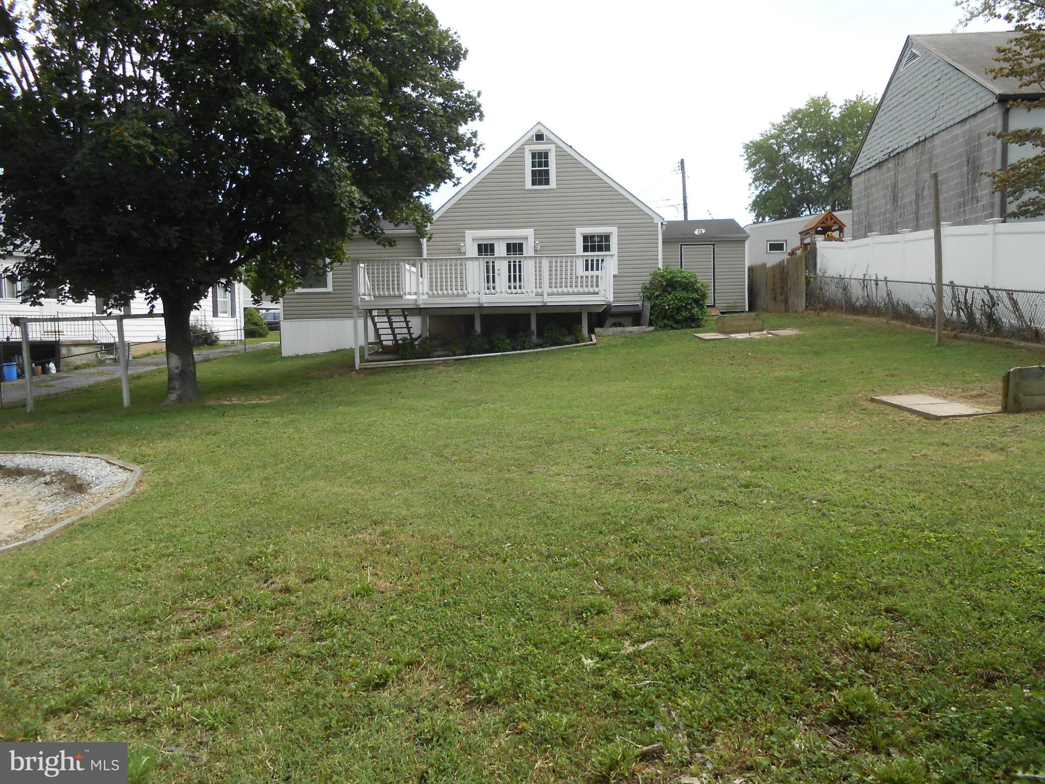 2405 Meadow Road Baltimore, MD 21222 - Photo 13 of 13 a front view of a house with garden
