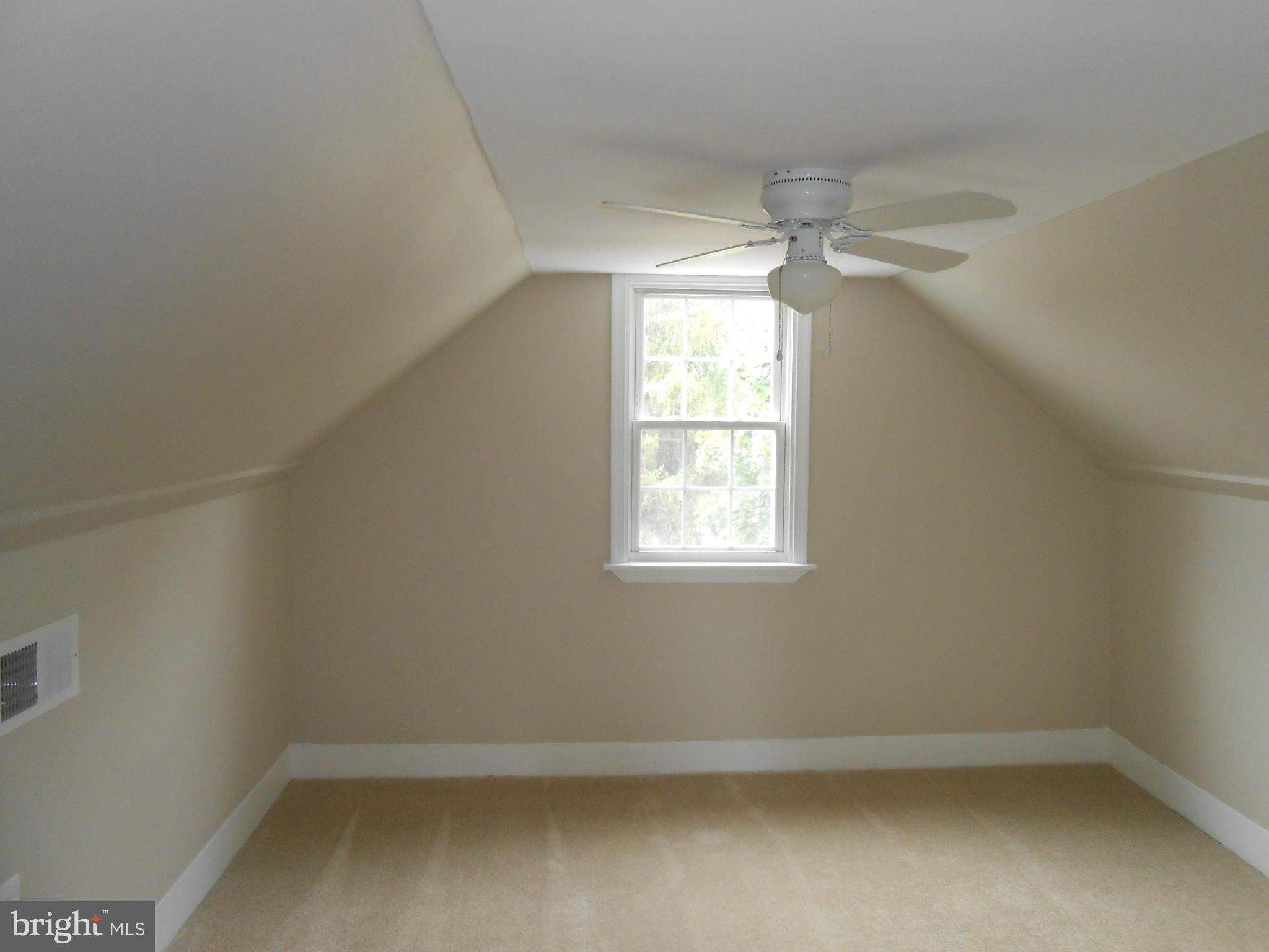 2405 Meadow Road Baltimore, MD 21222 - Photo 9 of 13 an empty room with a window
