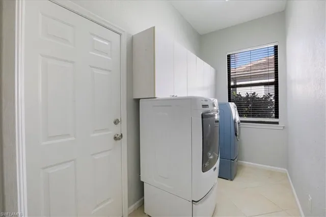 a utility room with washer and dryer