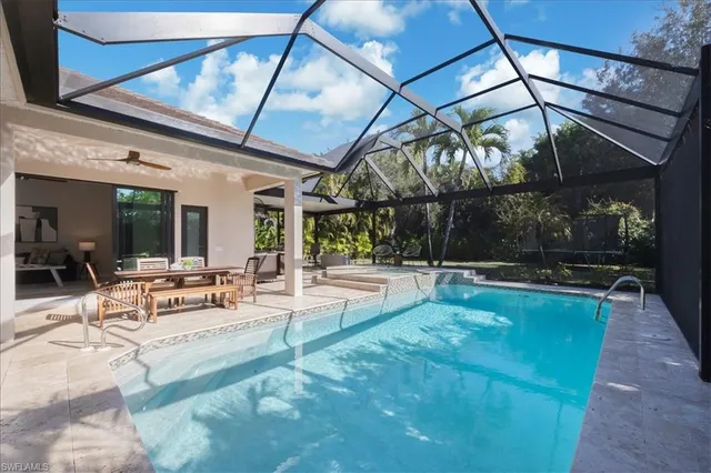 a view of a patio with a table and chairs