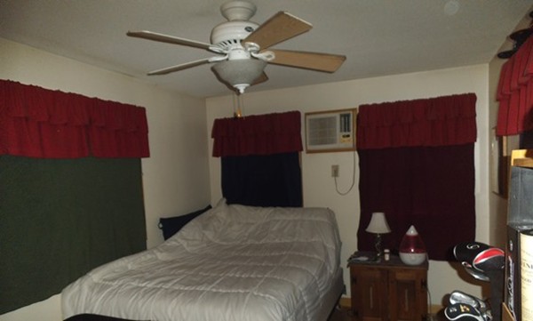 192 Davis Street Springfield, MA 01104 - Photo 7 of 7 a bedroom with a bed dresser and a window