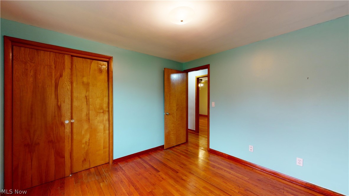 6400 Brookside Road Independence, OH 44131 - Photo 24 of 47 Unfurnished bedroom with wood-type flooring and a closet