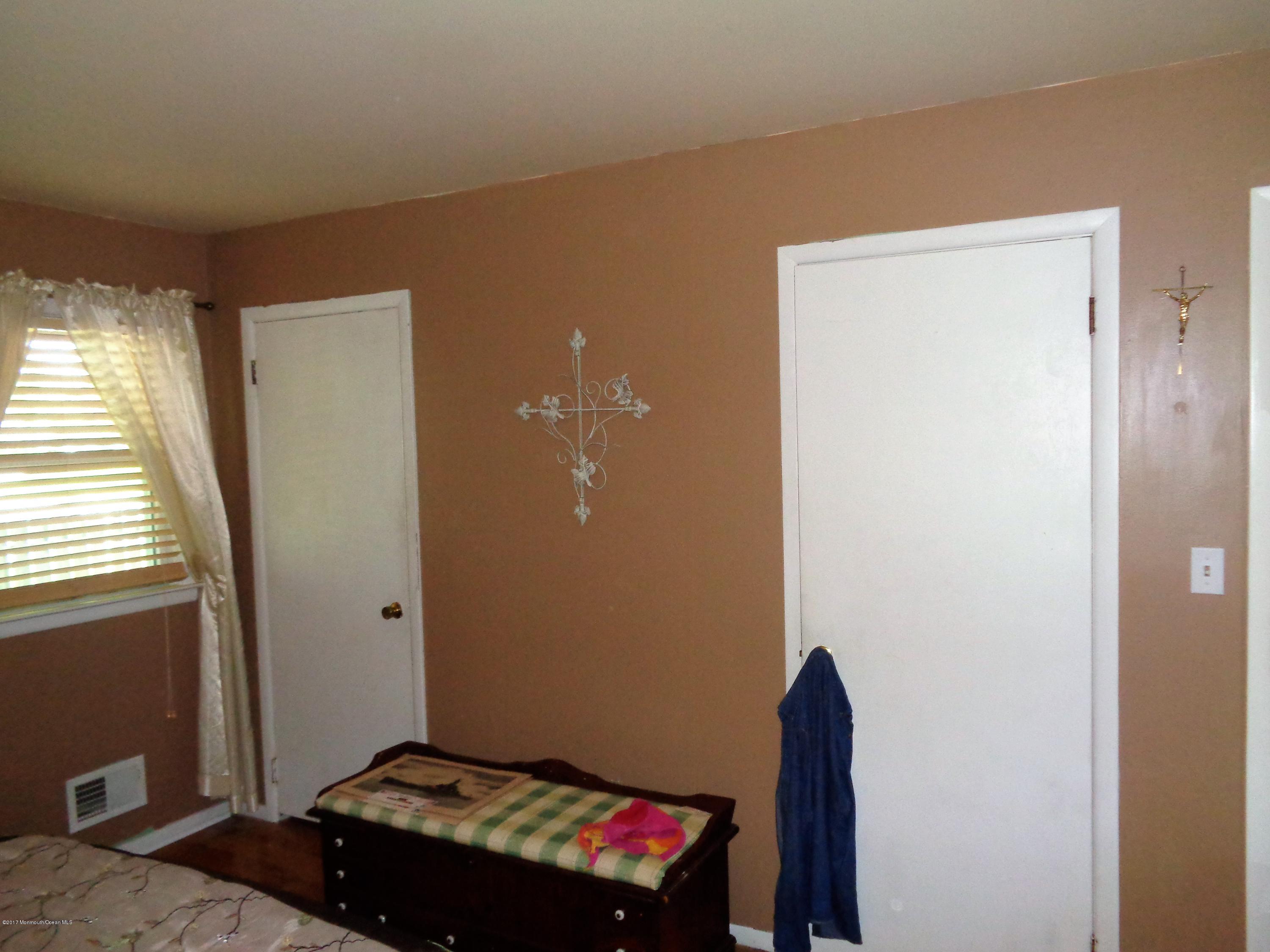 25 Pepperridge Road Howell, NJ 07731 - Photo 12 of 28 a bedroom with a bed and a window