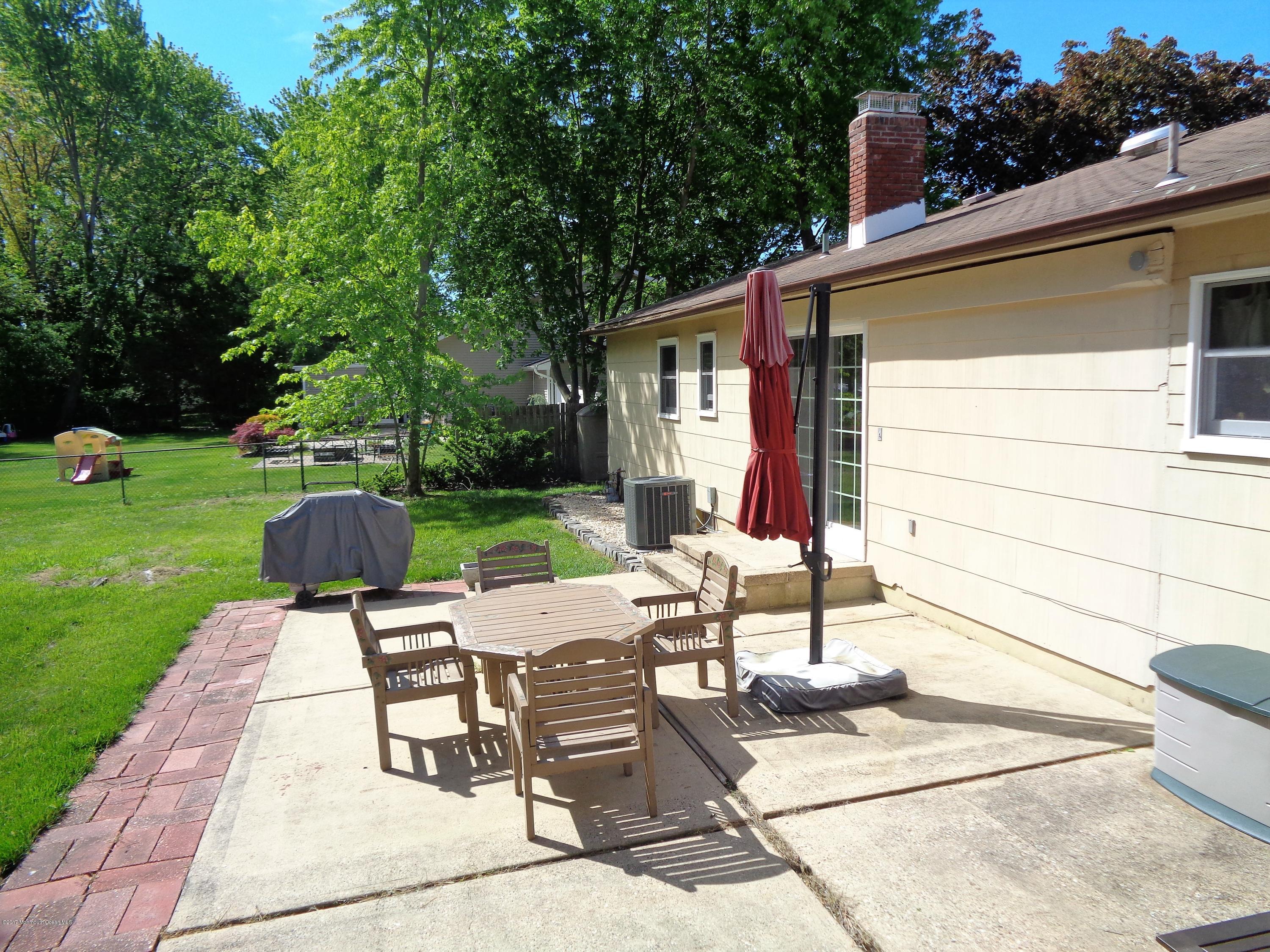 25 Pepperridge Road Howell, NJ 07731 - Photo 16 of 28 a view of backyard with patio