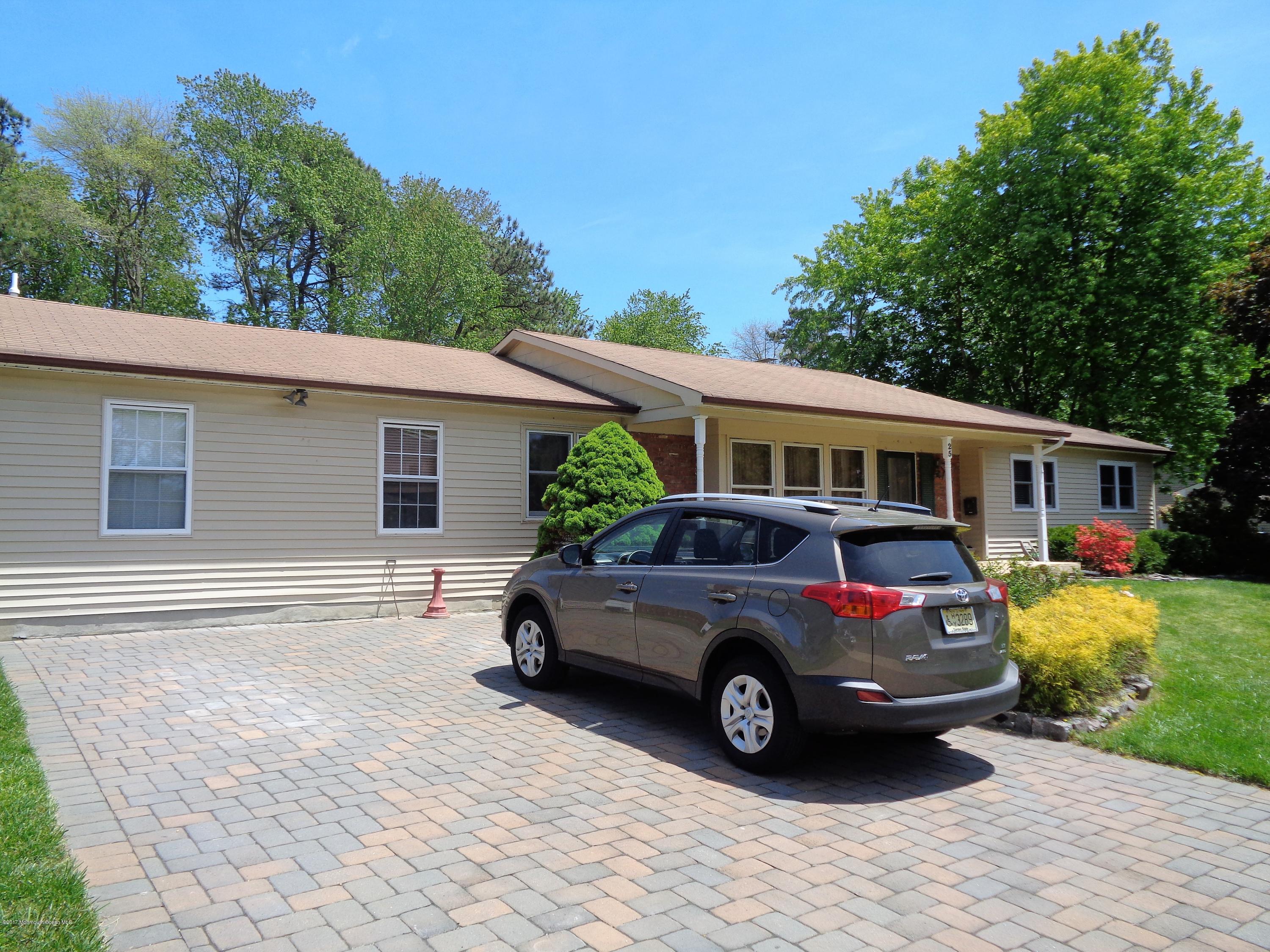 25 Pepperridge Road Howell, NJ 07731 - Photo 18 of 28 a car parked in front of a house