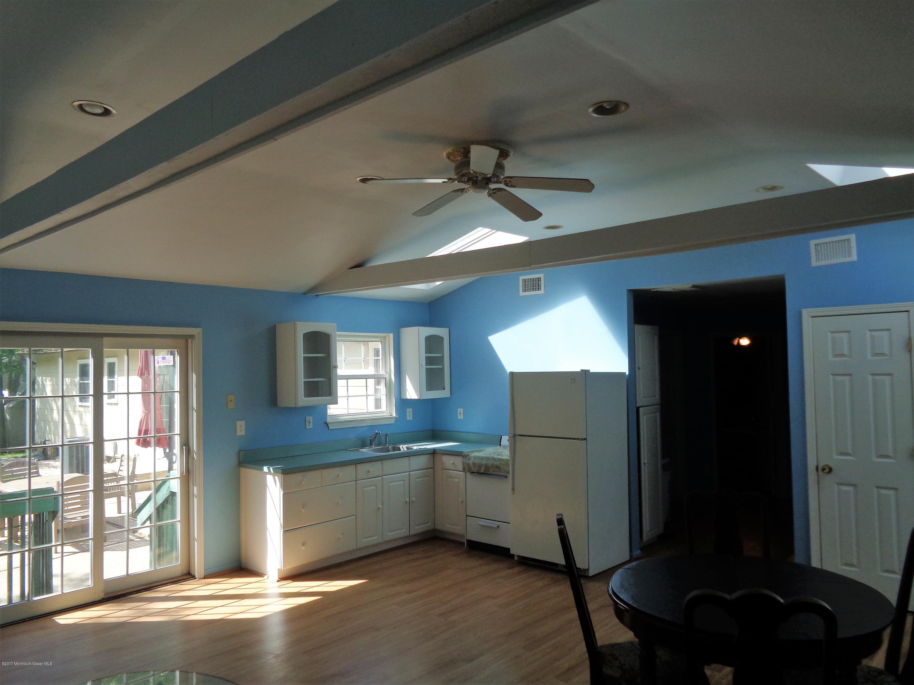 25 Pepperridge Road Howell, NJ 07731 - Photo 20 of 28 a kitchen with a refrigerator and a sink