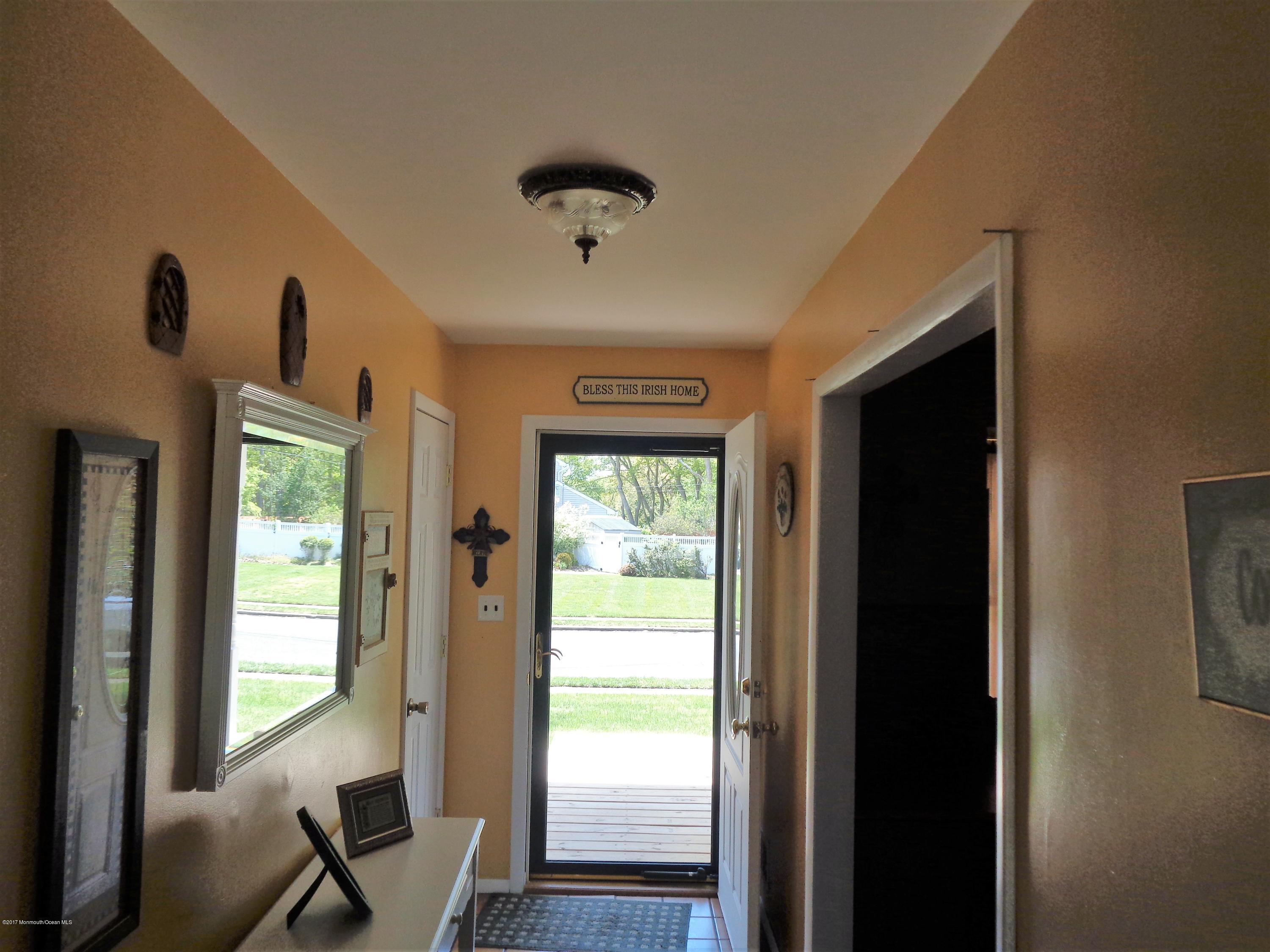 25 Pepperridge Road Howell, NJ 07731 - Photo 2 of 28 a view of a livingroom with a large window and wooden floor
