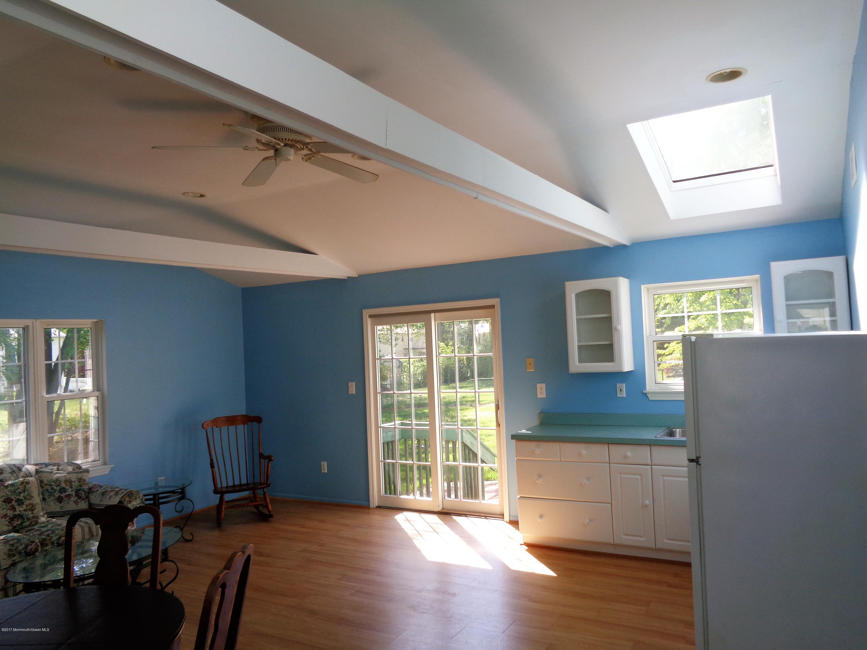 25 Pepperridge Road Howell, NJ 07731 - Photo 22 of 28 a furnished livingroom with windows and wooden floor