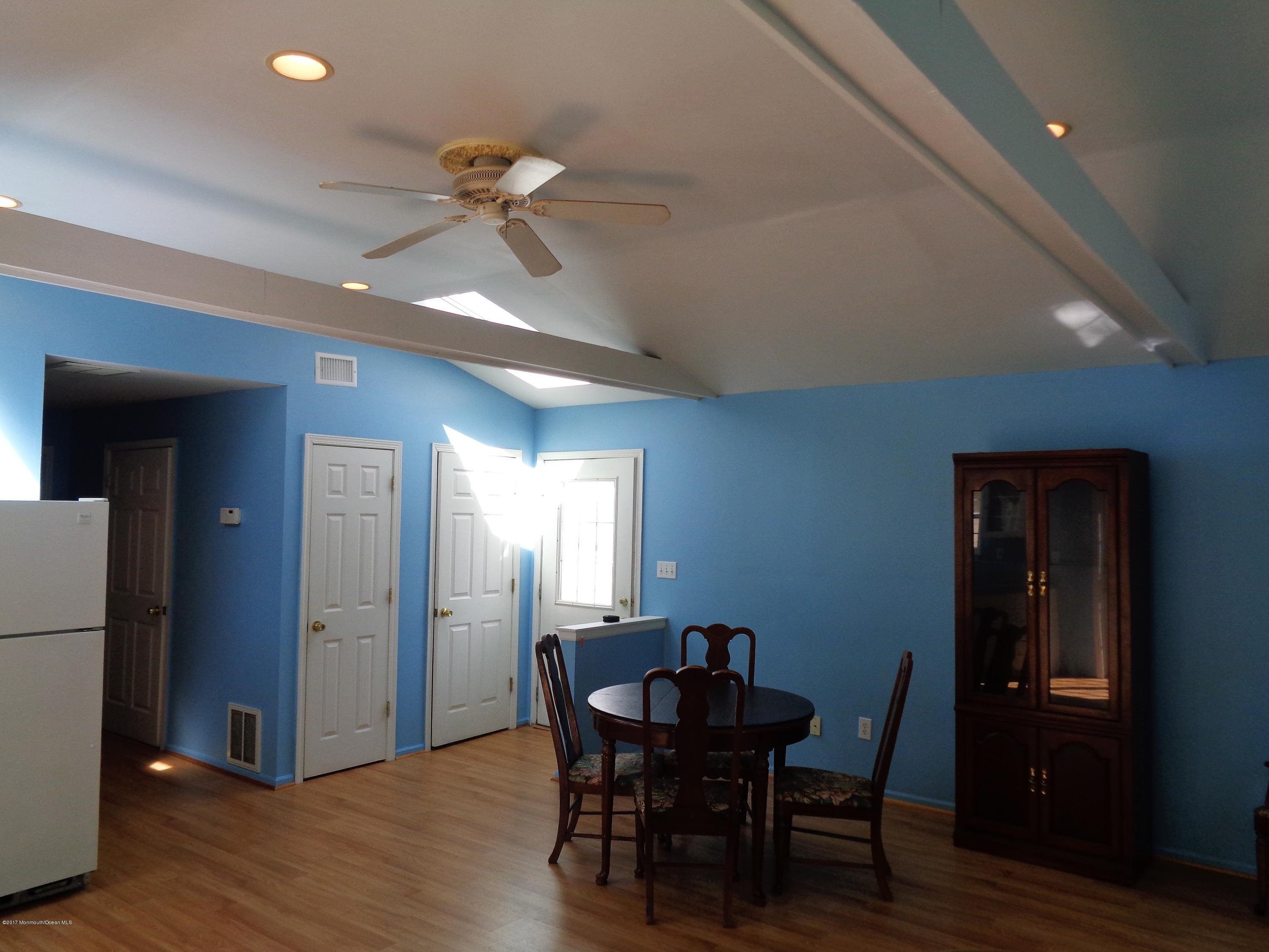 25 Pepperridge Road Howell, NJ 07731 - Photo 23 of 28 a view of a dining room with furniture and wooden floor