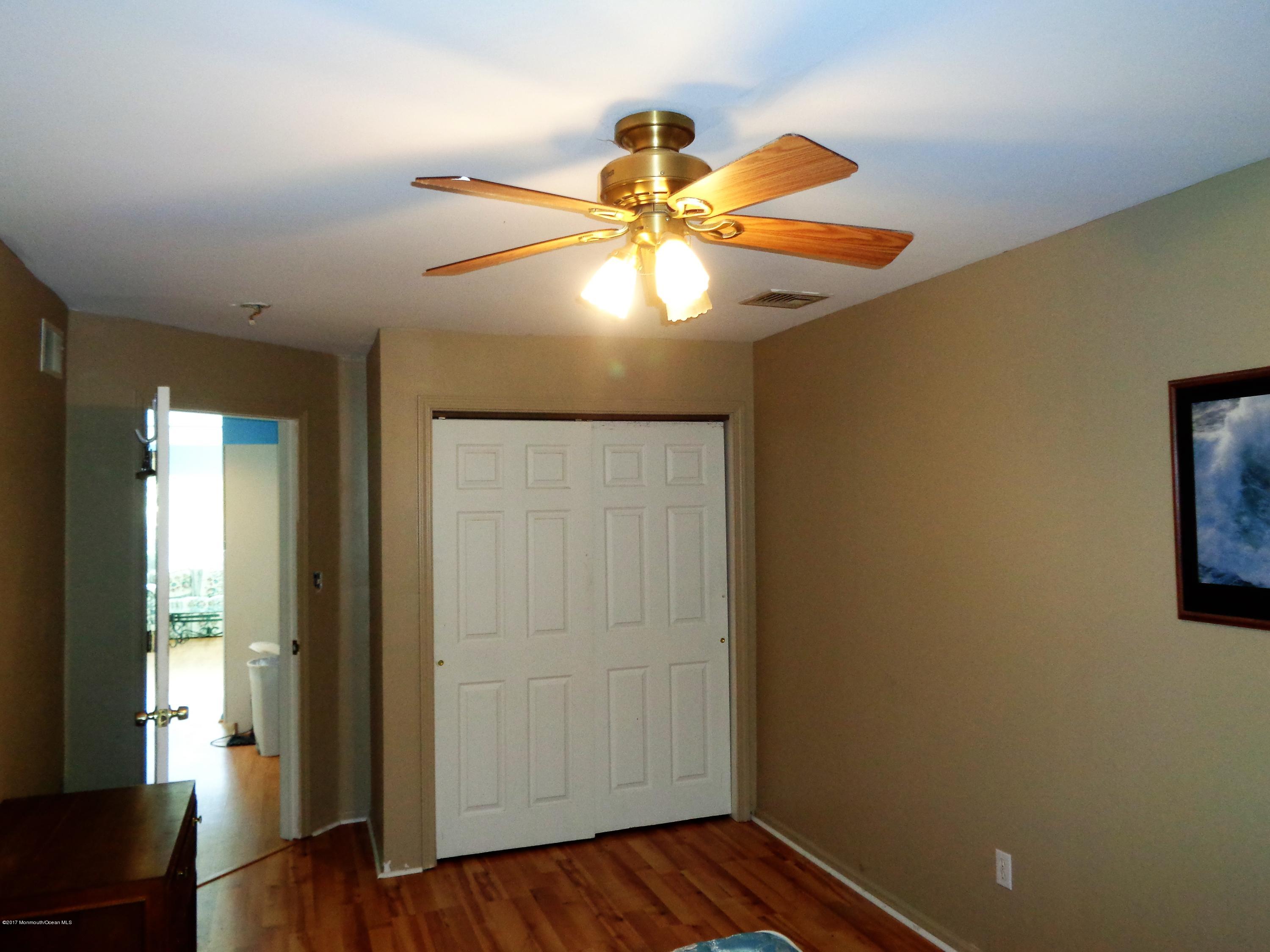 25 Pepperridge Road Howell, NJ 07731 - Photo 25 of 28 a view of an empty room with window and wooden floor