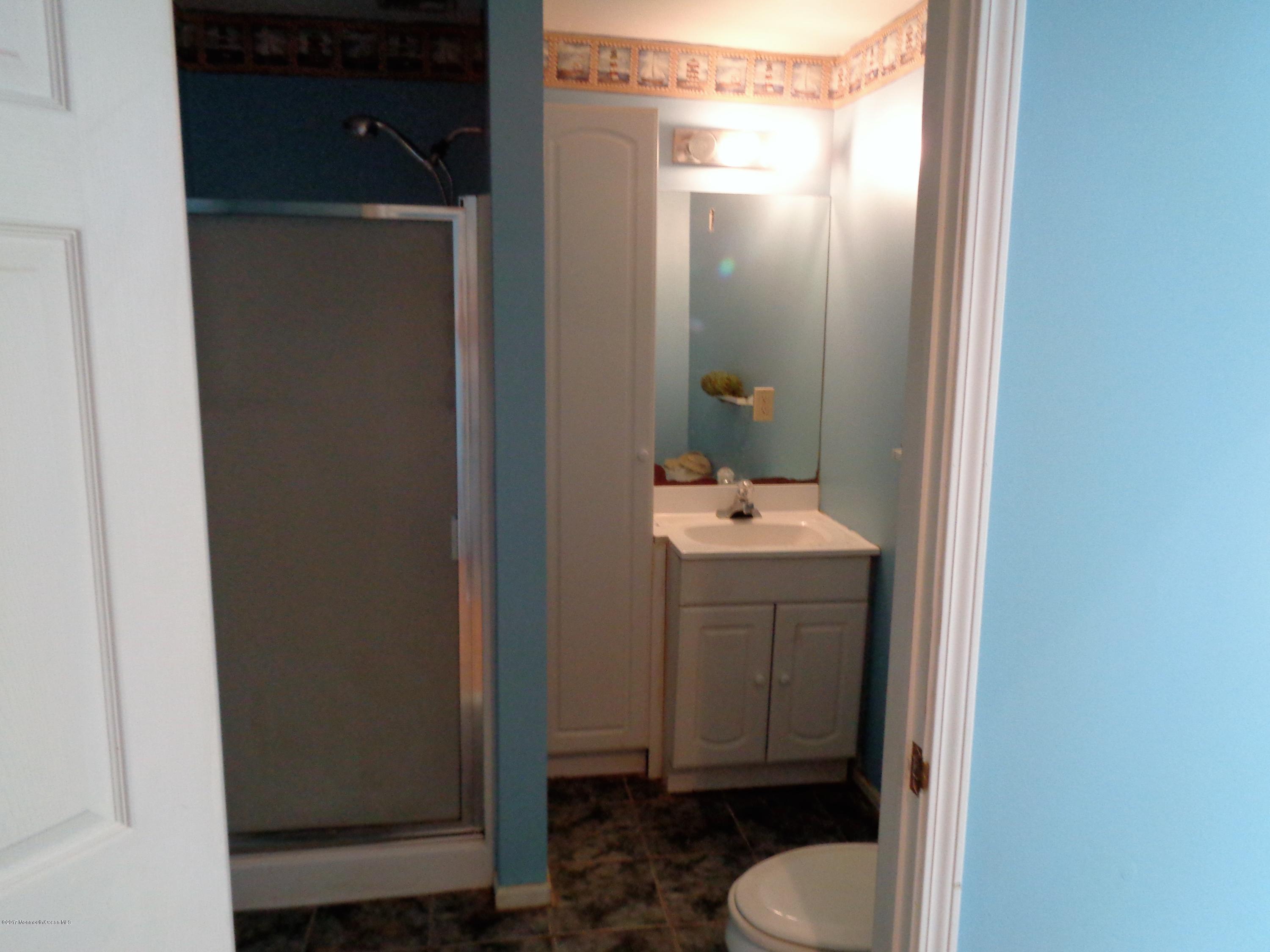 25 Pepperridge Road Howell, NJ 07731 - Photo 28 of 28 a bathroom with a sink and toilet
