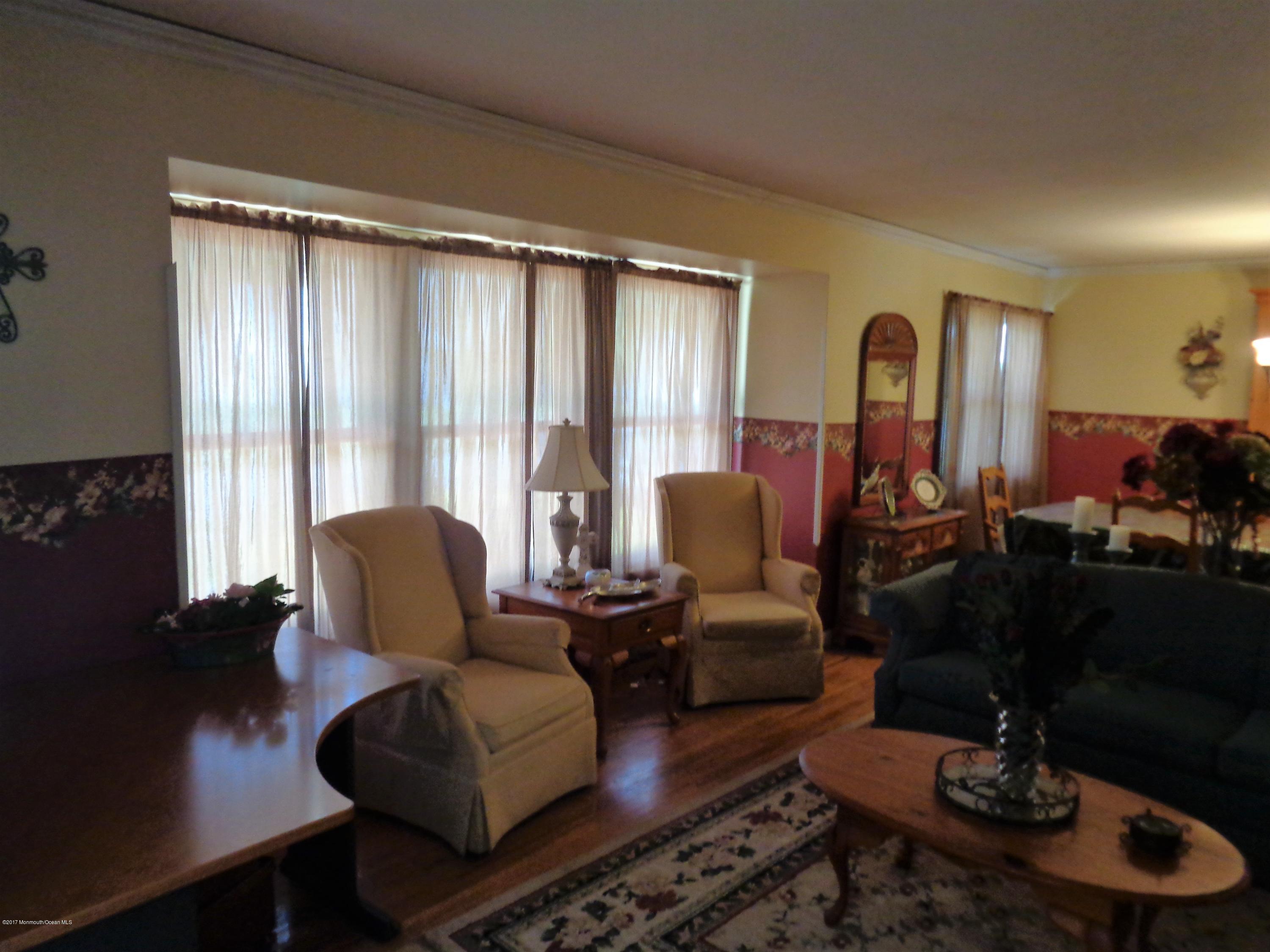 25 Pepperridge Road Howell, NJ 07731 - Photo 6 of 28 a living room with furniture and wooden floor