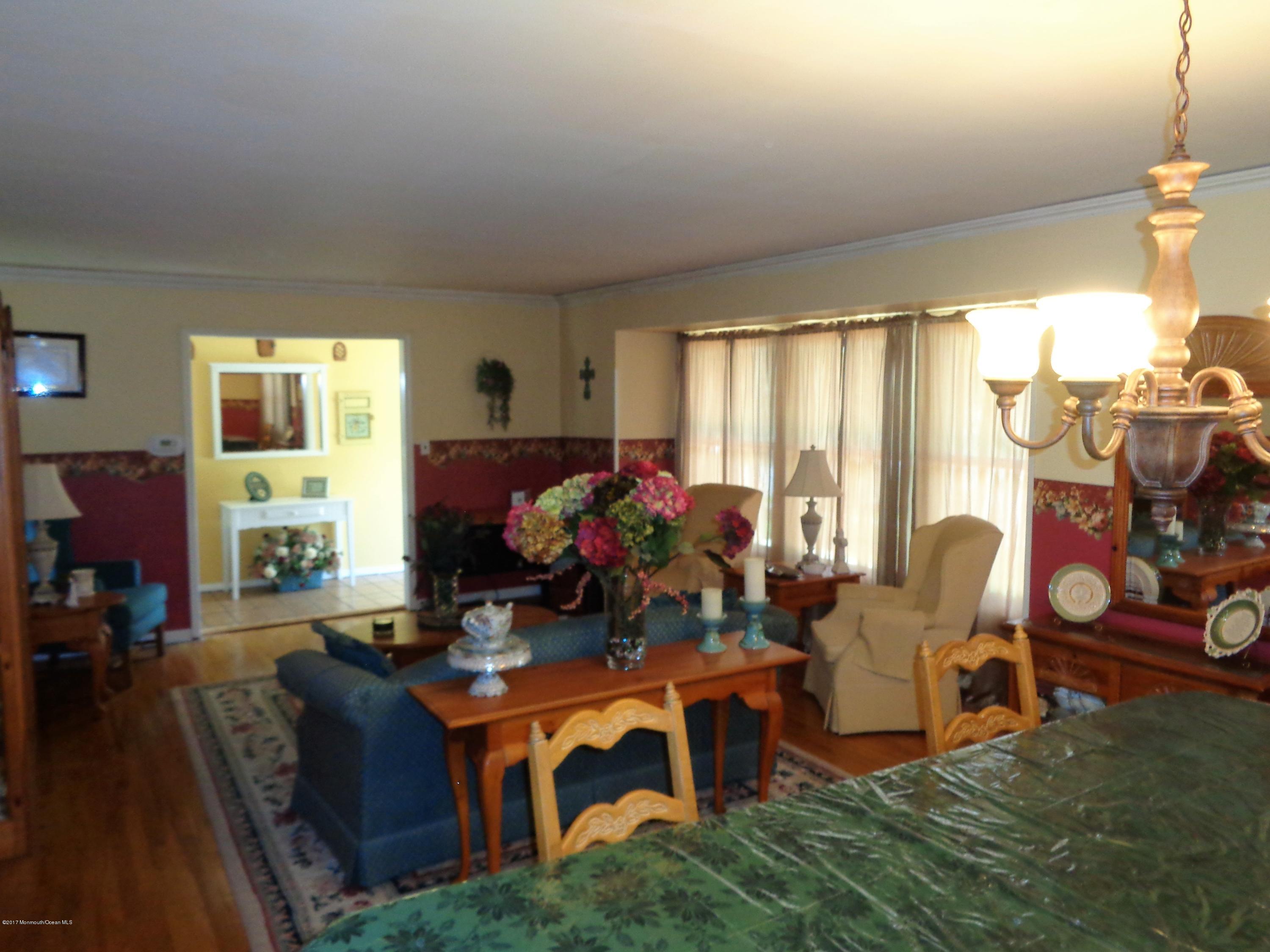25 Pepperridge Road Howell, NJ 07731 - Photo 7 of 28 a living room with furniture a window and a flat screen tv