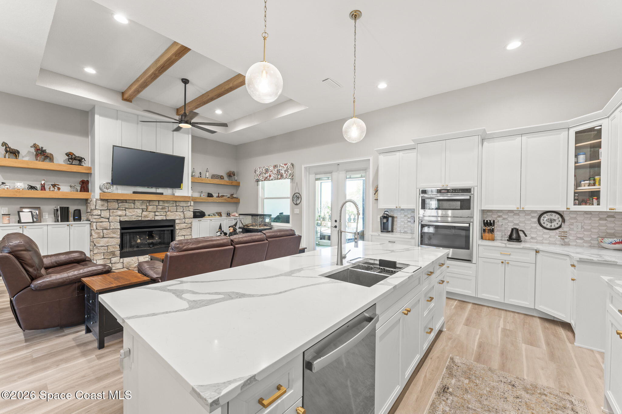 1740 Ford Road Mims, FL 32754 - Photo 14 of 43 a large kitchen with cabinets chairs and a stove