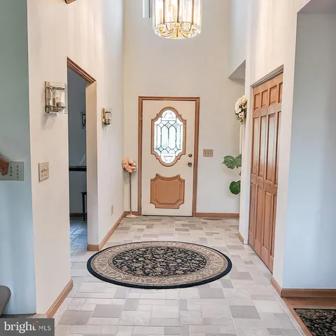 a bedroom with furniture and a mirror