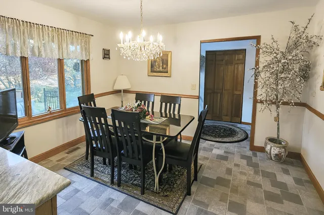 a bathroom with a bathtub sink and a mirror
