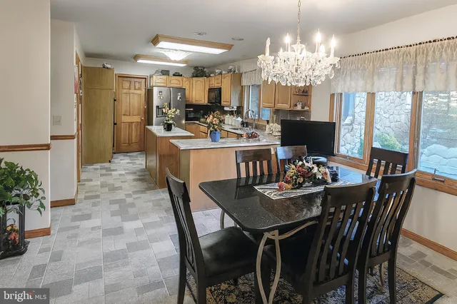 a view of a chairs and table in the patio