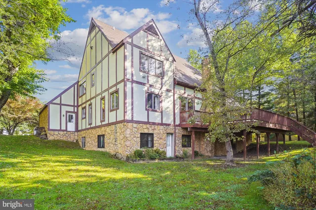 a living room with furniture ceiling fan and a rug