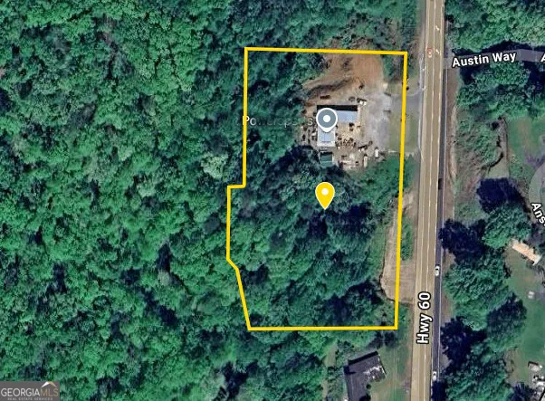 an aerial view of a house with a swimming pool