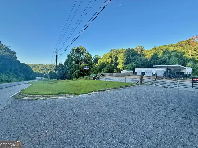 a view of outdoor space with playground and green space