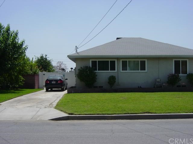151 West Morgan Street Rialto, CA 92376 - Photo 1 of 1 a front view of a house with a yard and garage