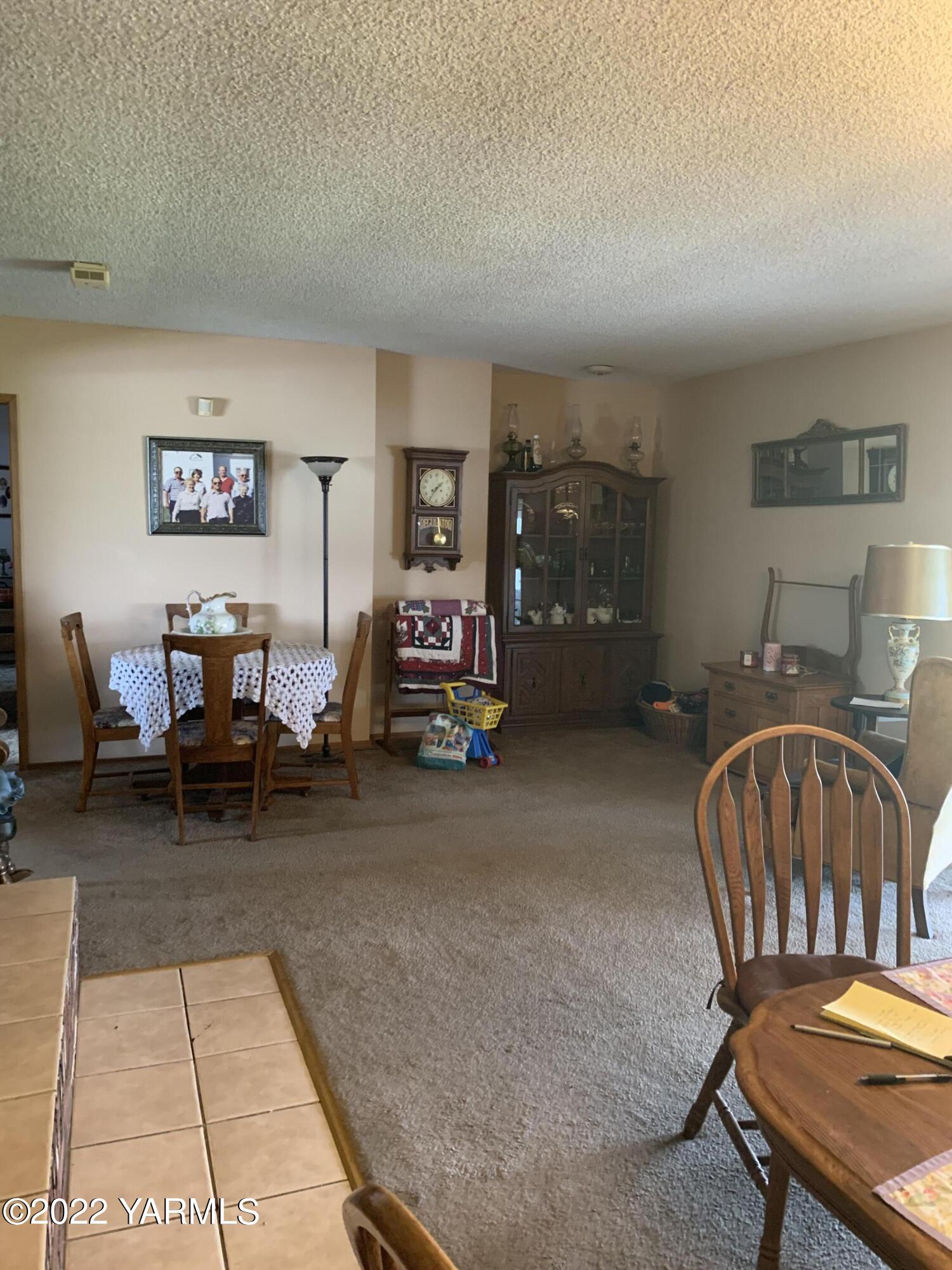 11105 Occidental Road Yakima, WA 98903 - Photo 13 of 30 a living room with furniture a rug and a table