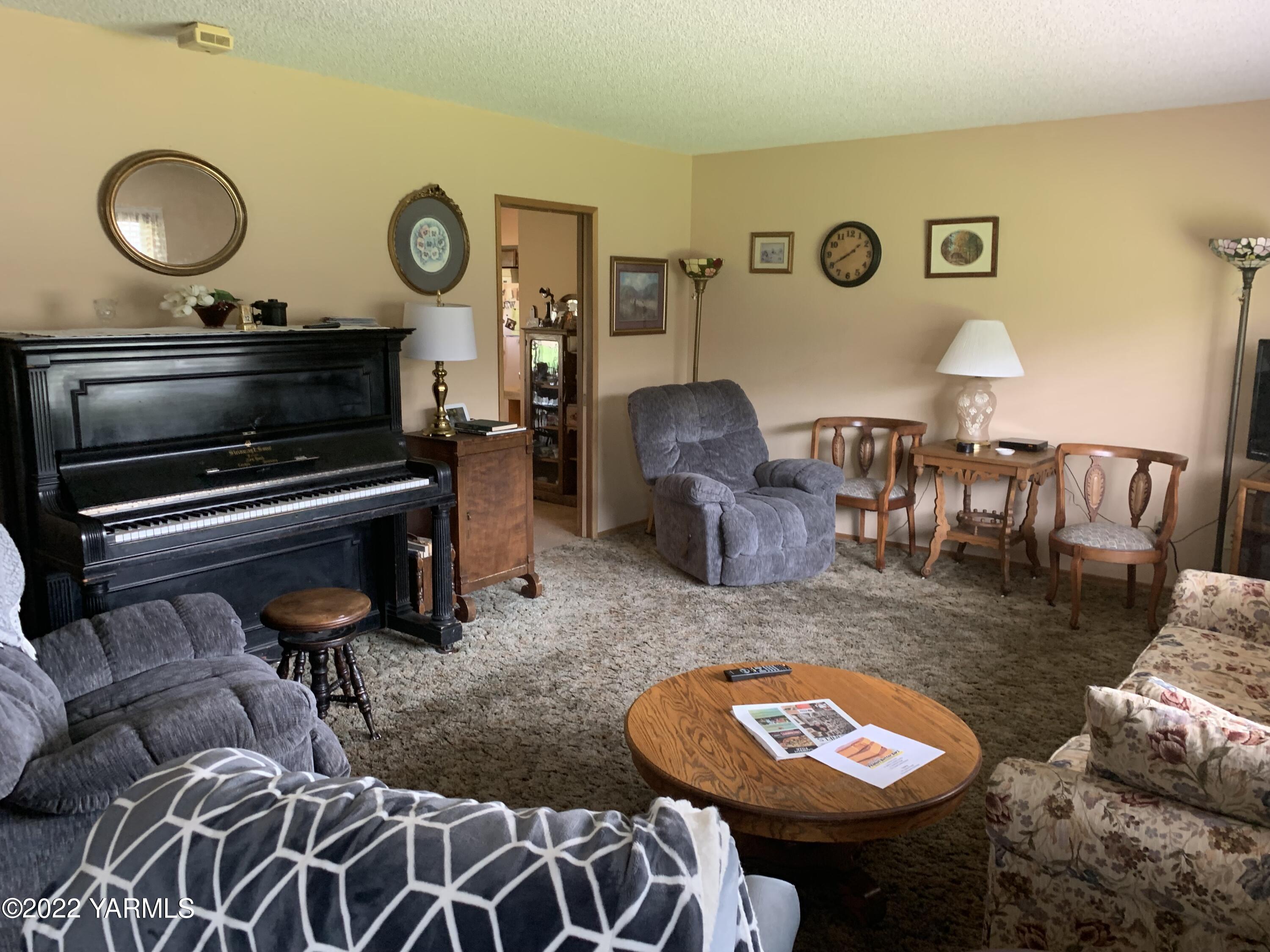 11105 Occidental Road Yakima, WA 98903 - Photo 15 of 30 a living room with furniture and a fireplace