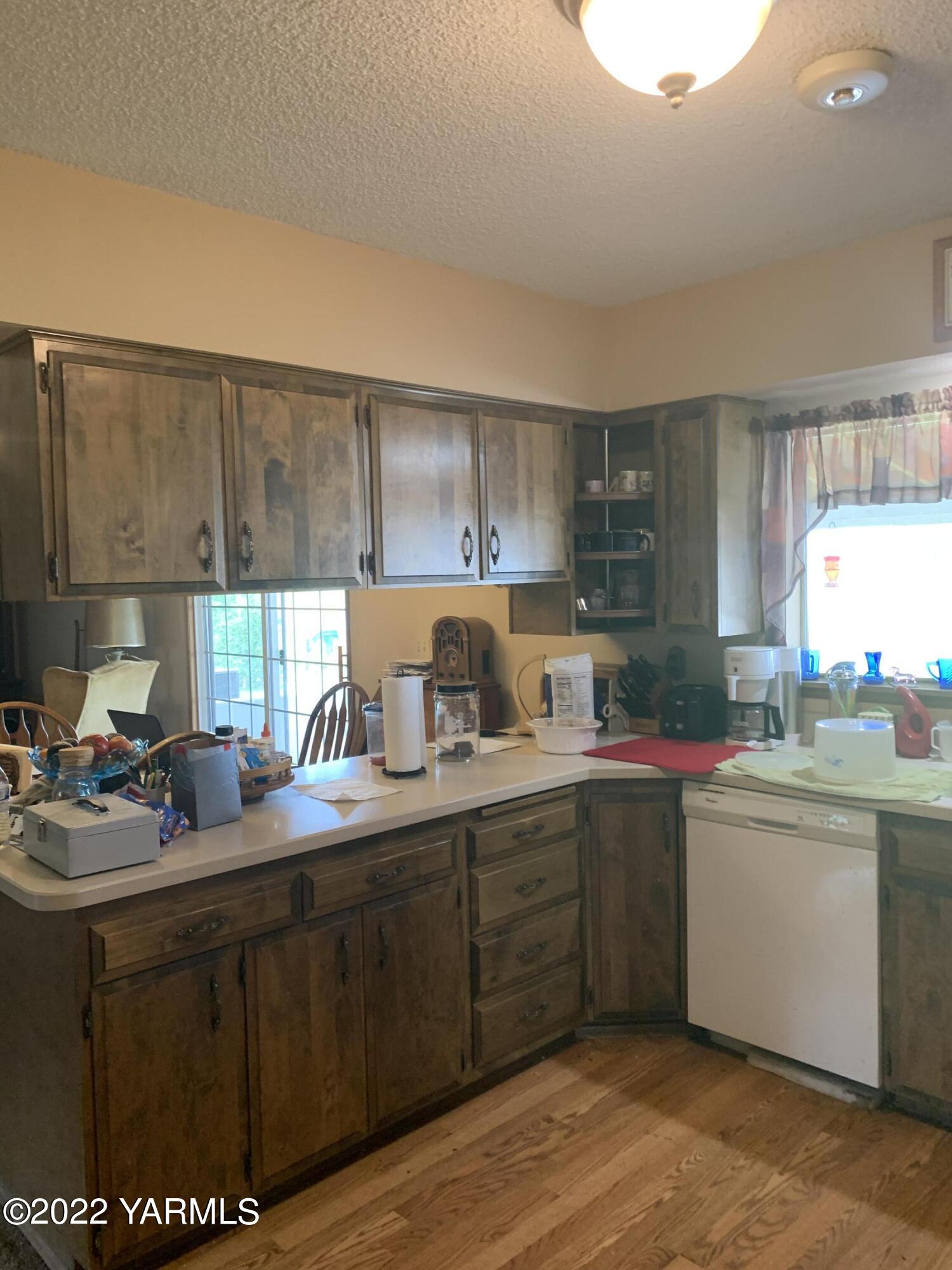 11105 Occidental Road Yakima, WA 98903 - Photo 18 of 30 a kitchen with a sink cabinets and window