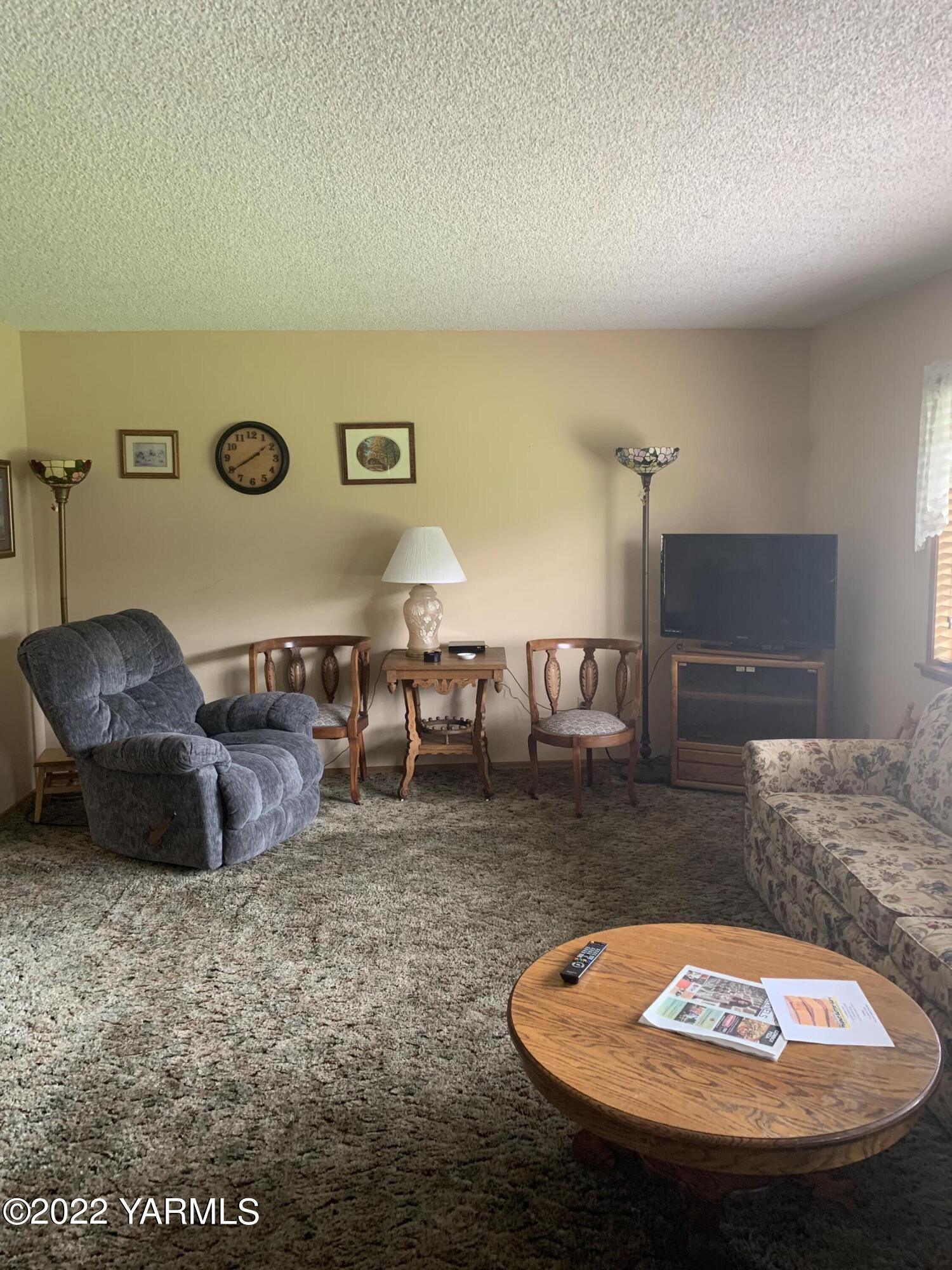 11105 Occidental Road Yakima, WA 98903 - Photo 19 of 30 a living room with furniture and a rug