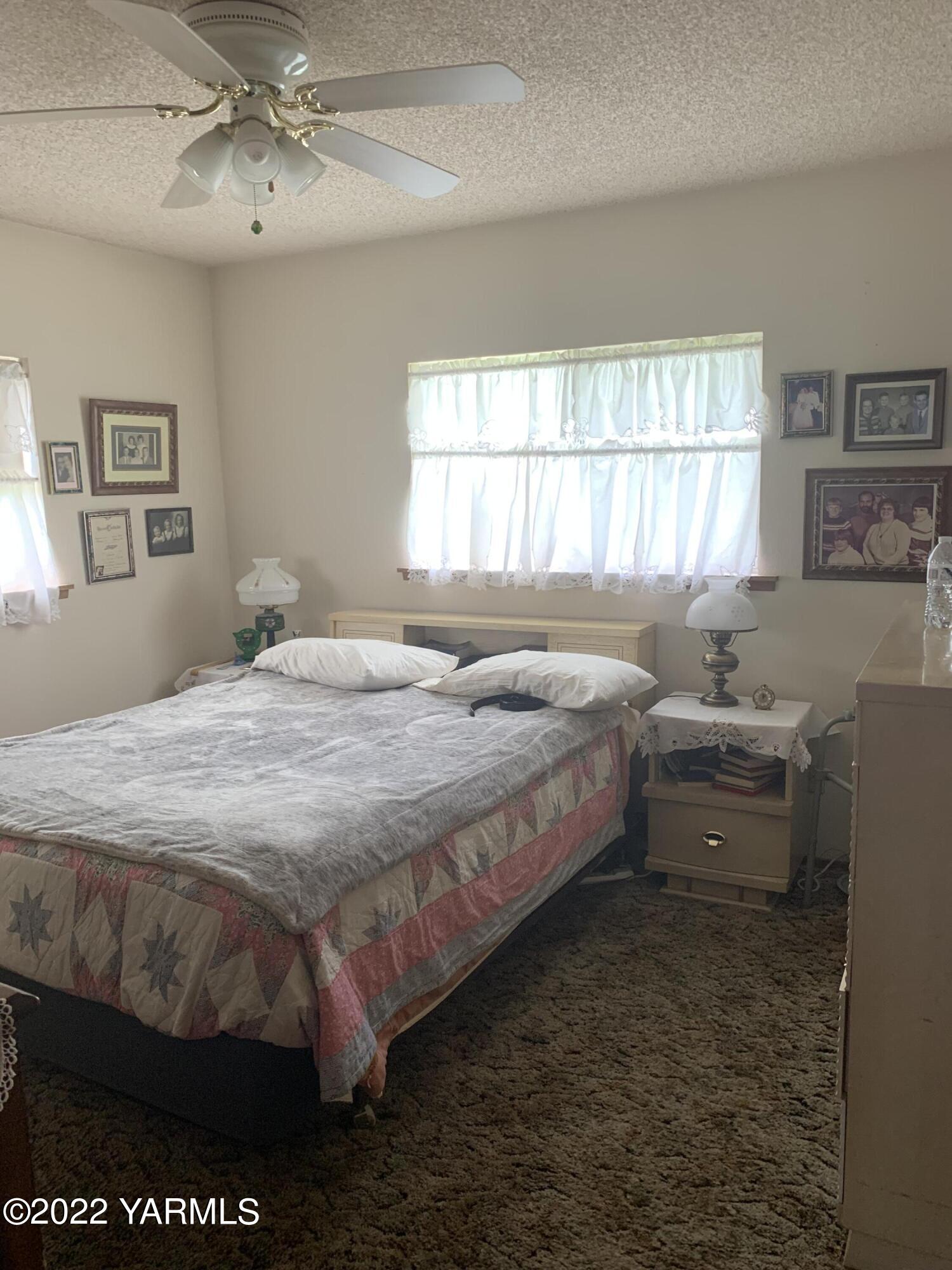 11105 Occidental Road Yakima, WA 98903 - Photo 26 of 30 a bedroom with a bed and window