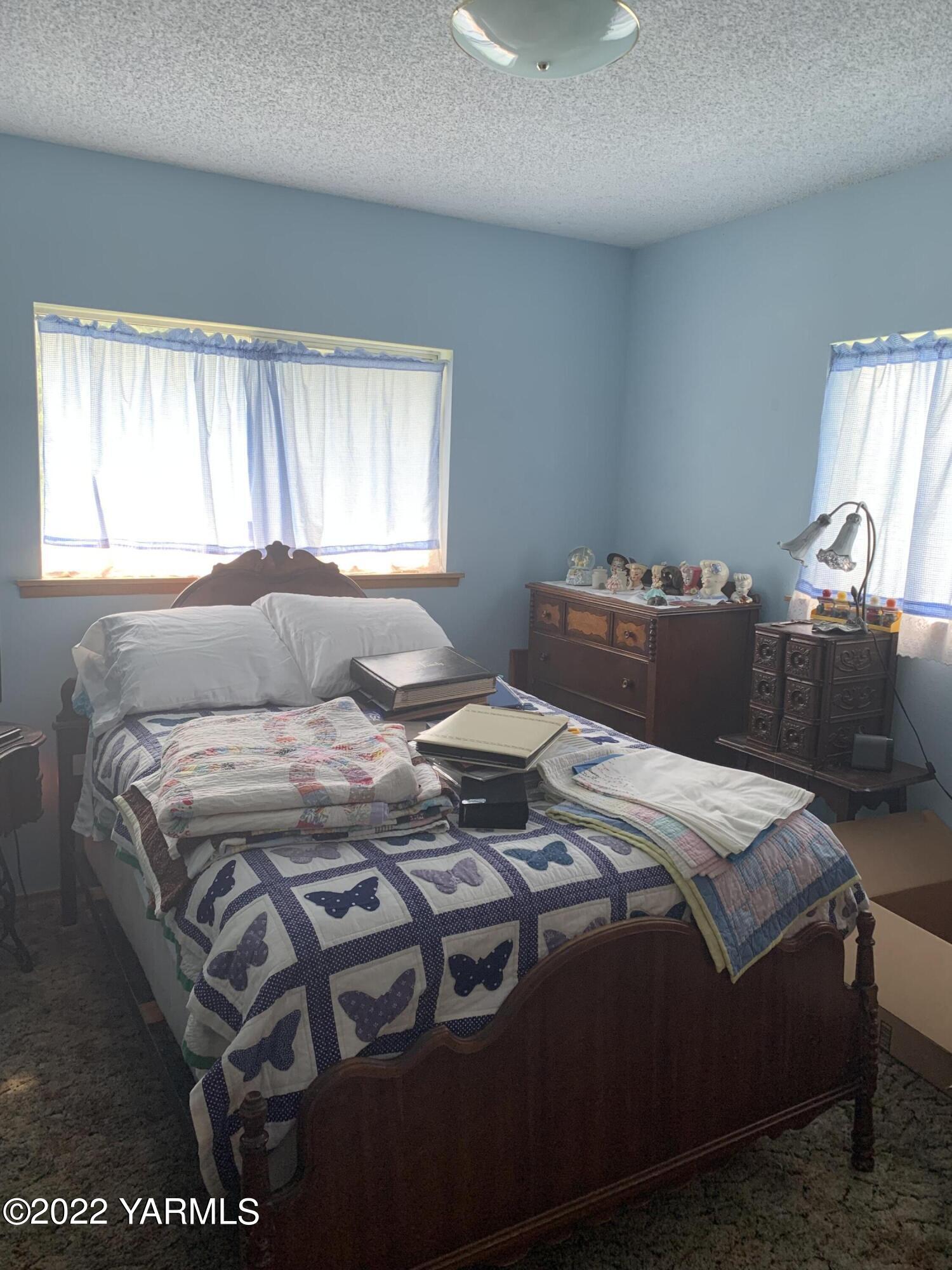11105 Occidental Road Yakima, WA 98903 - Photo 29 of 30 a bedroom with a bed and window