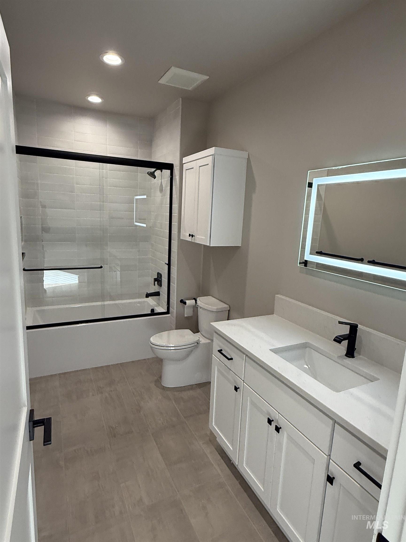 14059 Mulberry McCall, ID 83638 - Photo 16 of 32 Bathroom featuring combined bath / shower with glass door, vanity, and recessed lighting