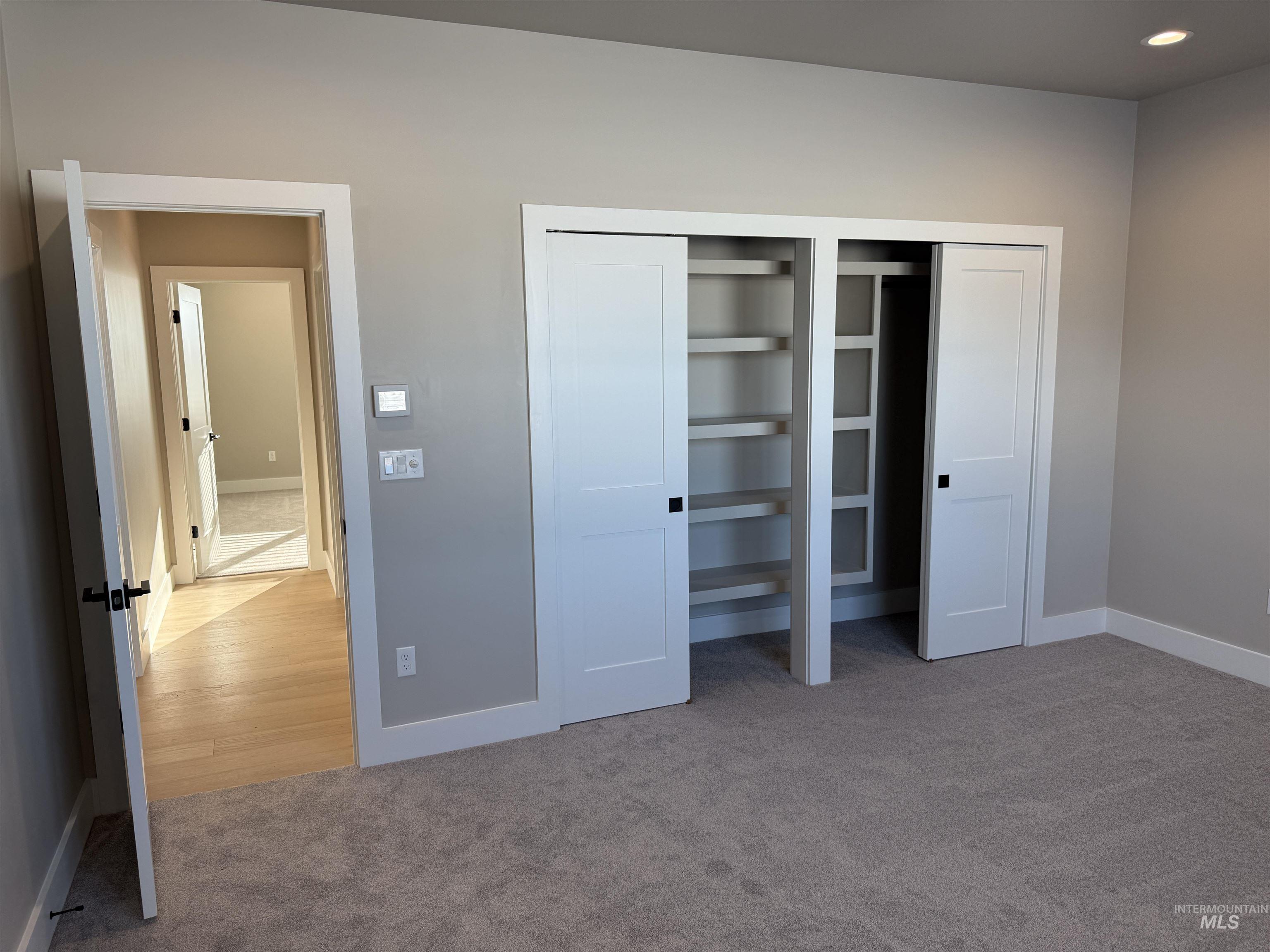 14059 Mulberry McCall, ID 83638 - Photo 17 of 32 Bedroom featuring multiple closets and light carpet