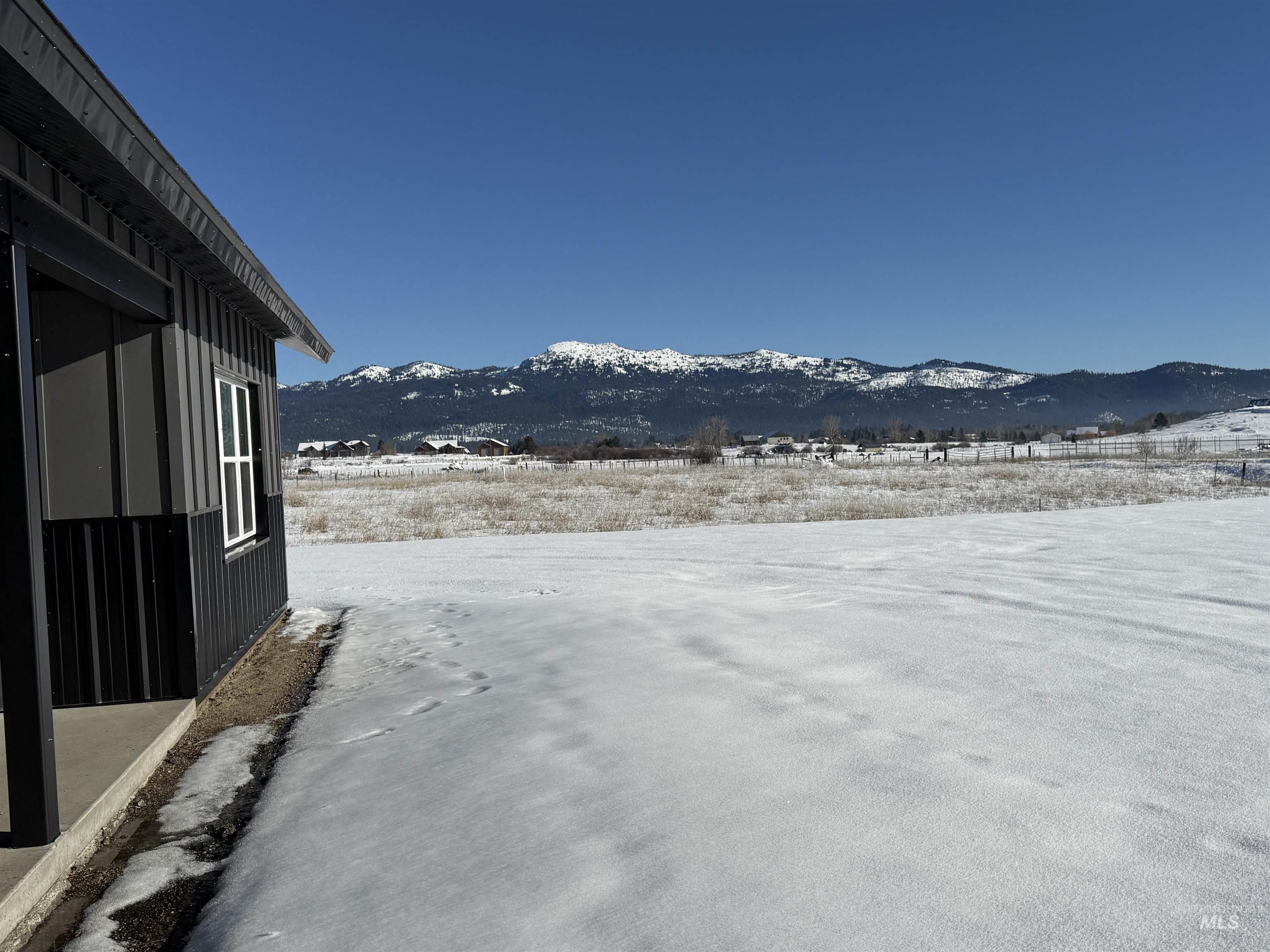 14059 Mulberry McCall, ID 83638 - Photo 26 of 32 Yard layered in snow with a mountain view