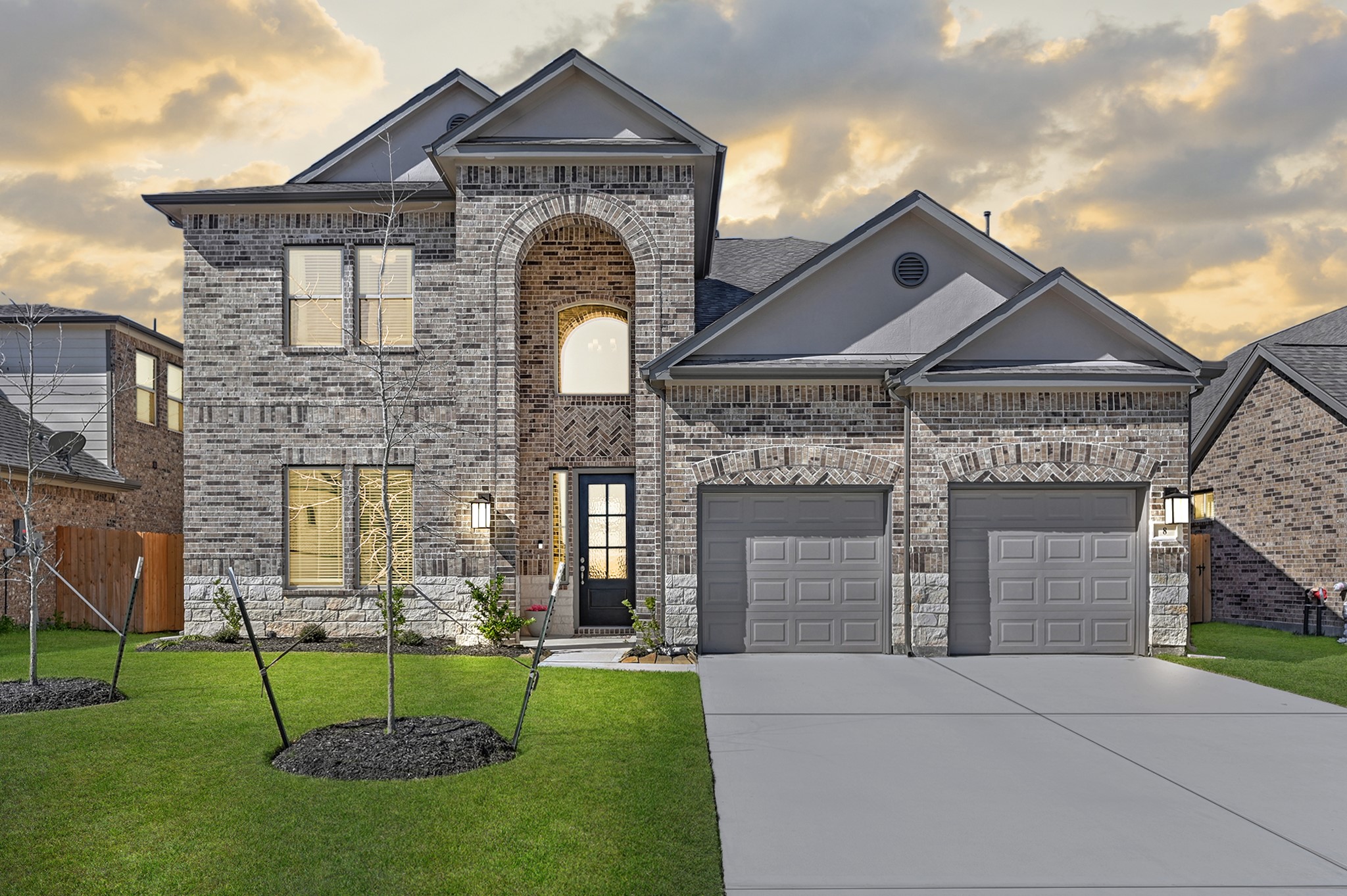 8 Palmero Way Manvel, TX 77578 - Photo 1 of 34 a front view of a house with a garden and plants