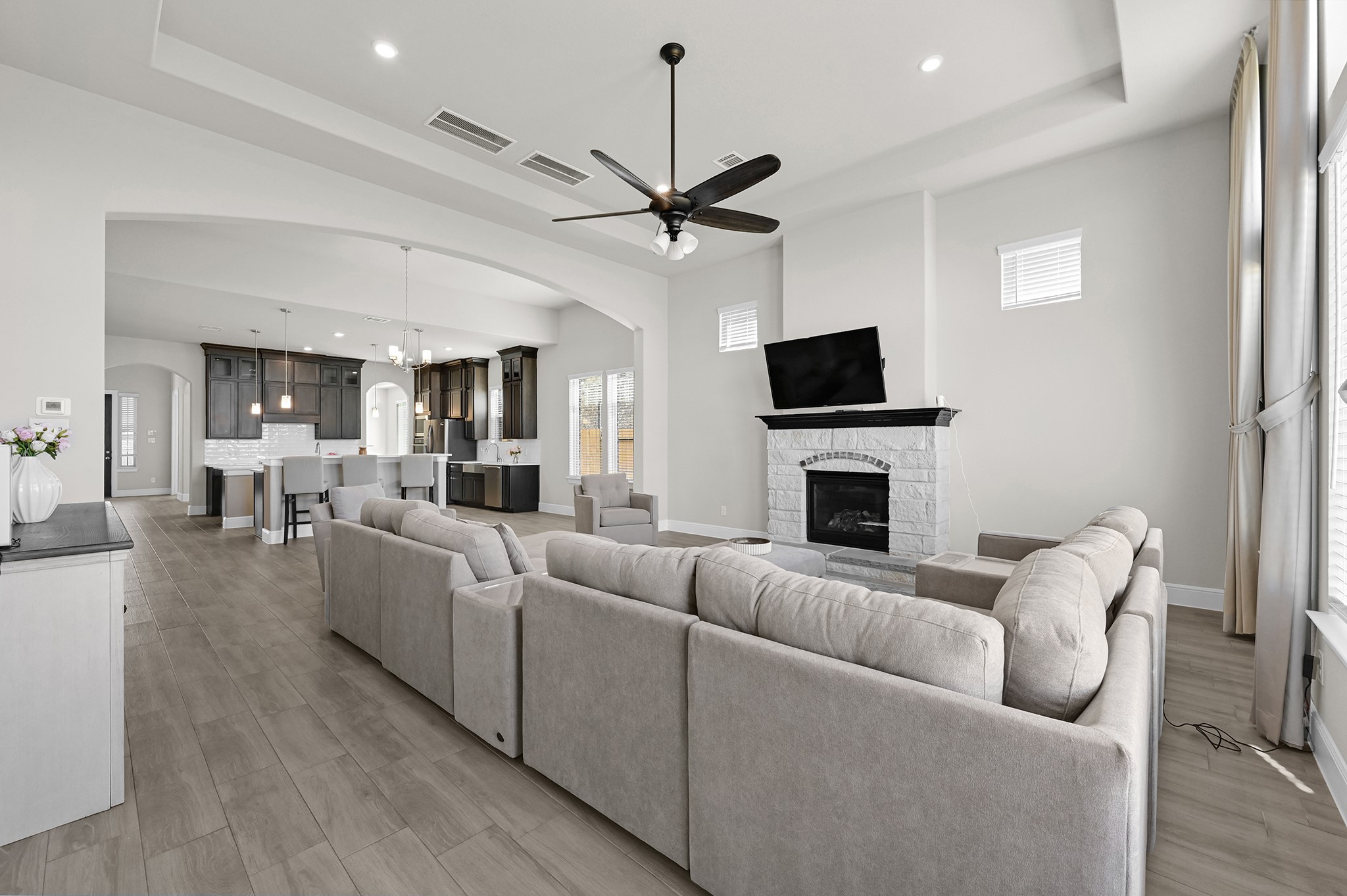 8 Palmero Way Manvel, TX 77578 - Photo 13 of 34 a living room with furniture a fireplace and a flat screen tv