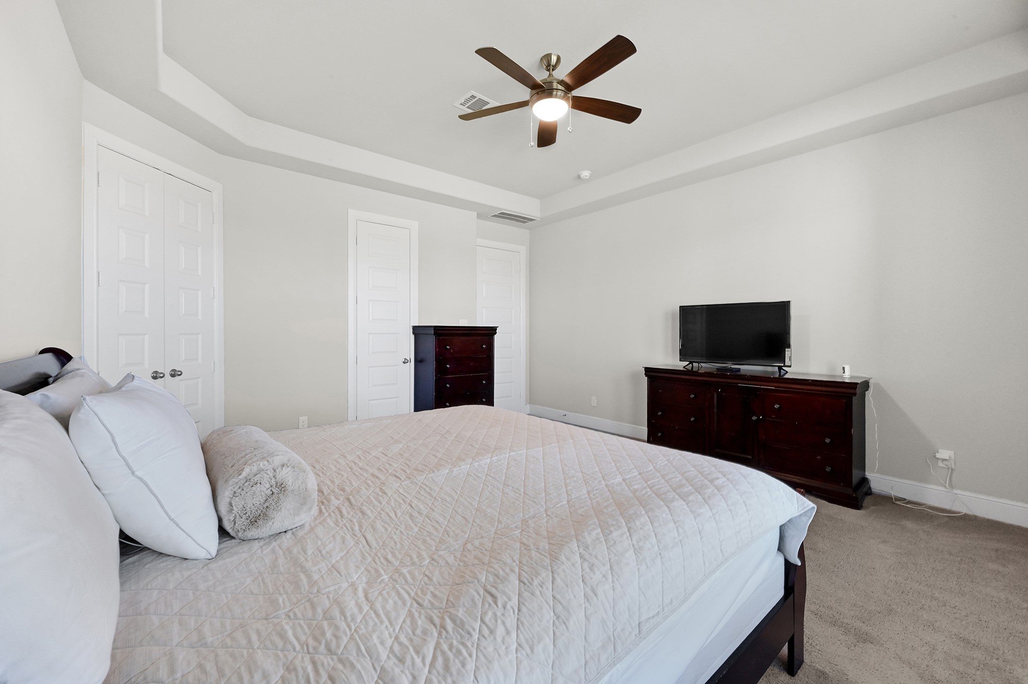 8 Palmero Way Manvel, TX 77578 - Photo 15 of 34 a bedroom with a bed and a tv