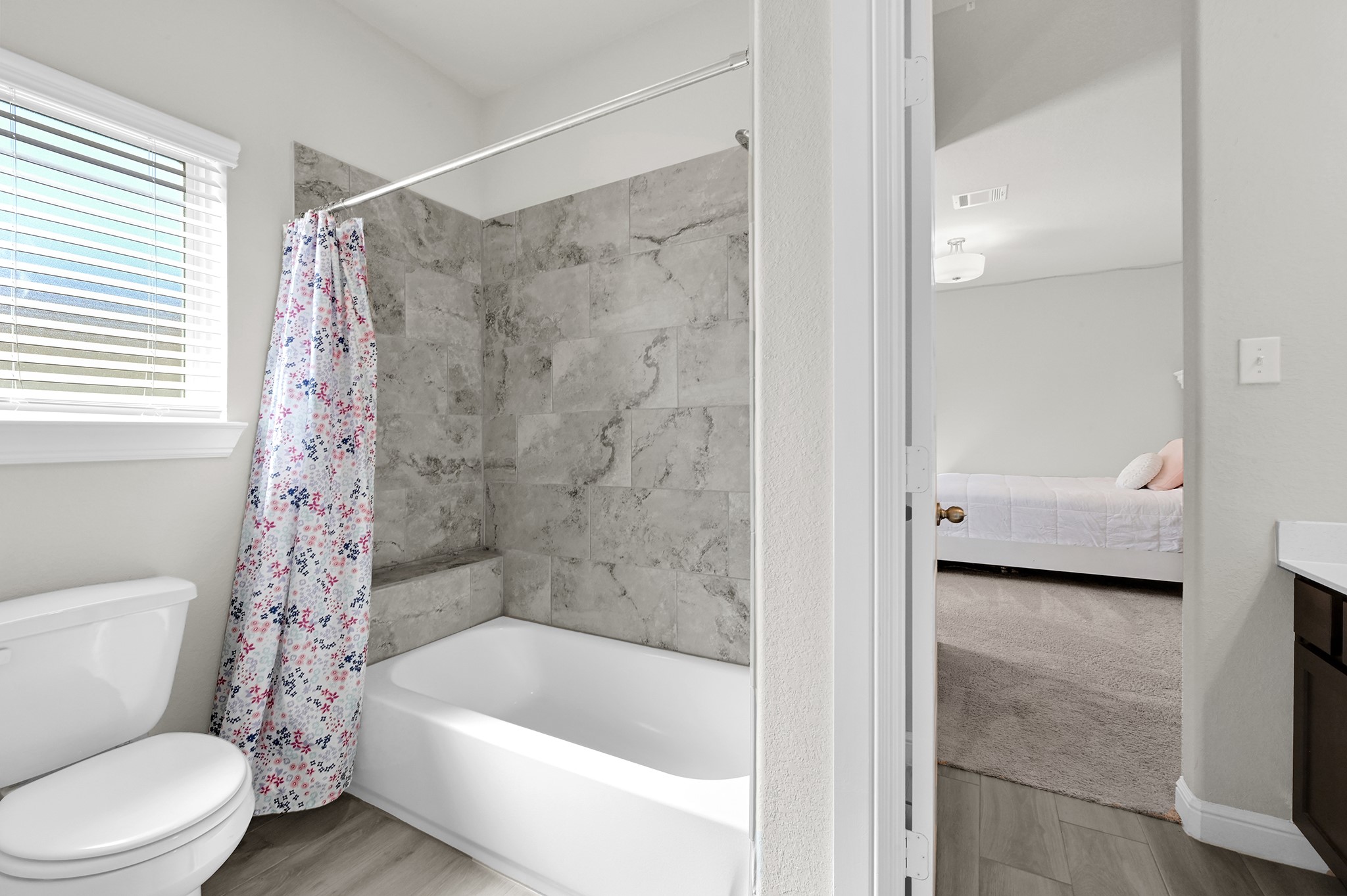 8 Palmero Way Manvel, TX 77578 - Photo 22 of 34 a bathroom with a tub shower and toilet