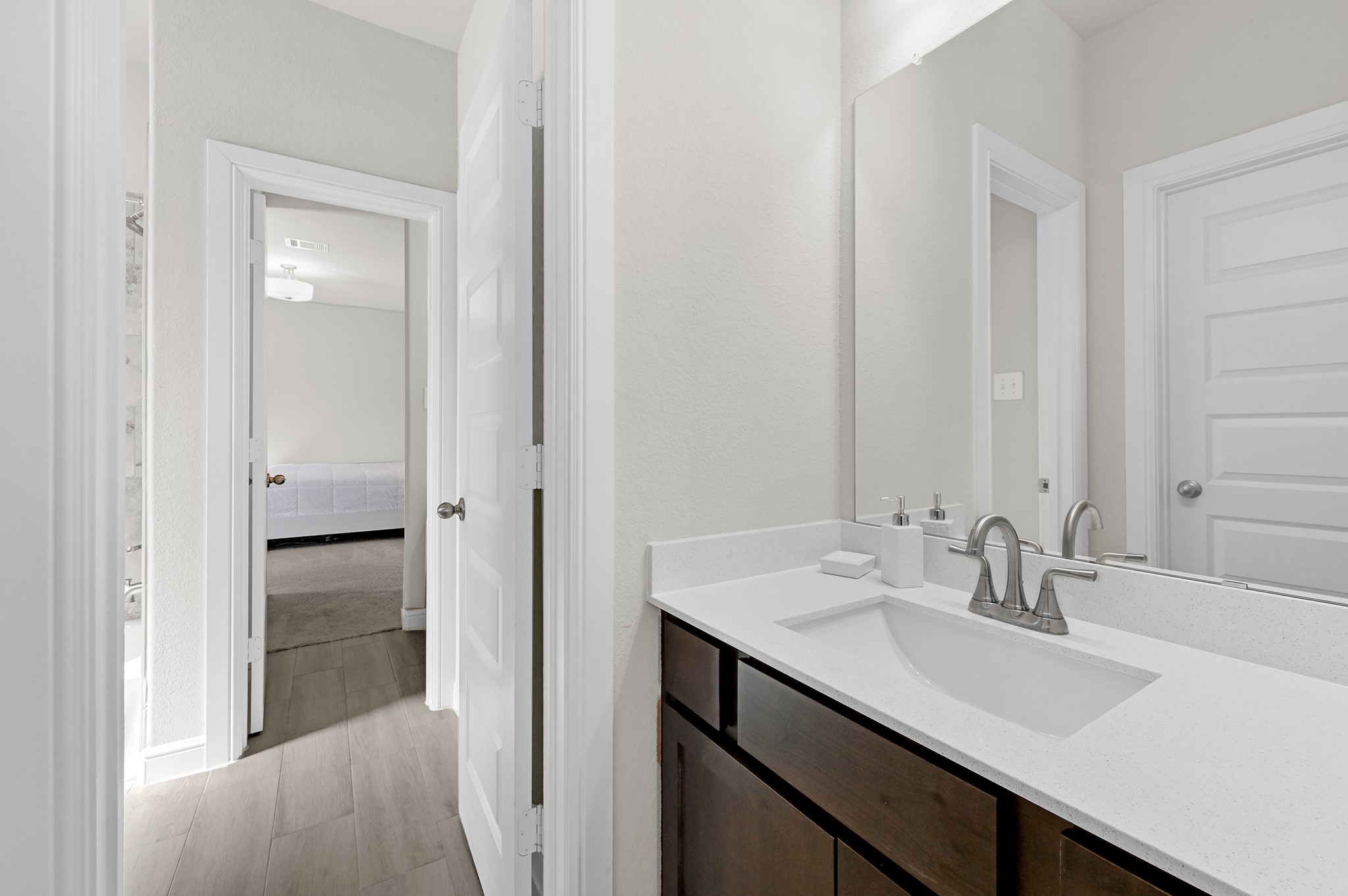 8 Palmero Way Manvel, TX 77578 - Photo 23 of 34 a bathroom with a sink and a mirror